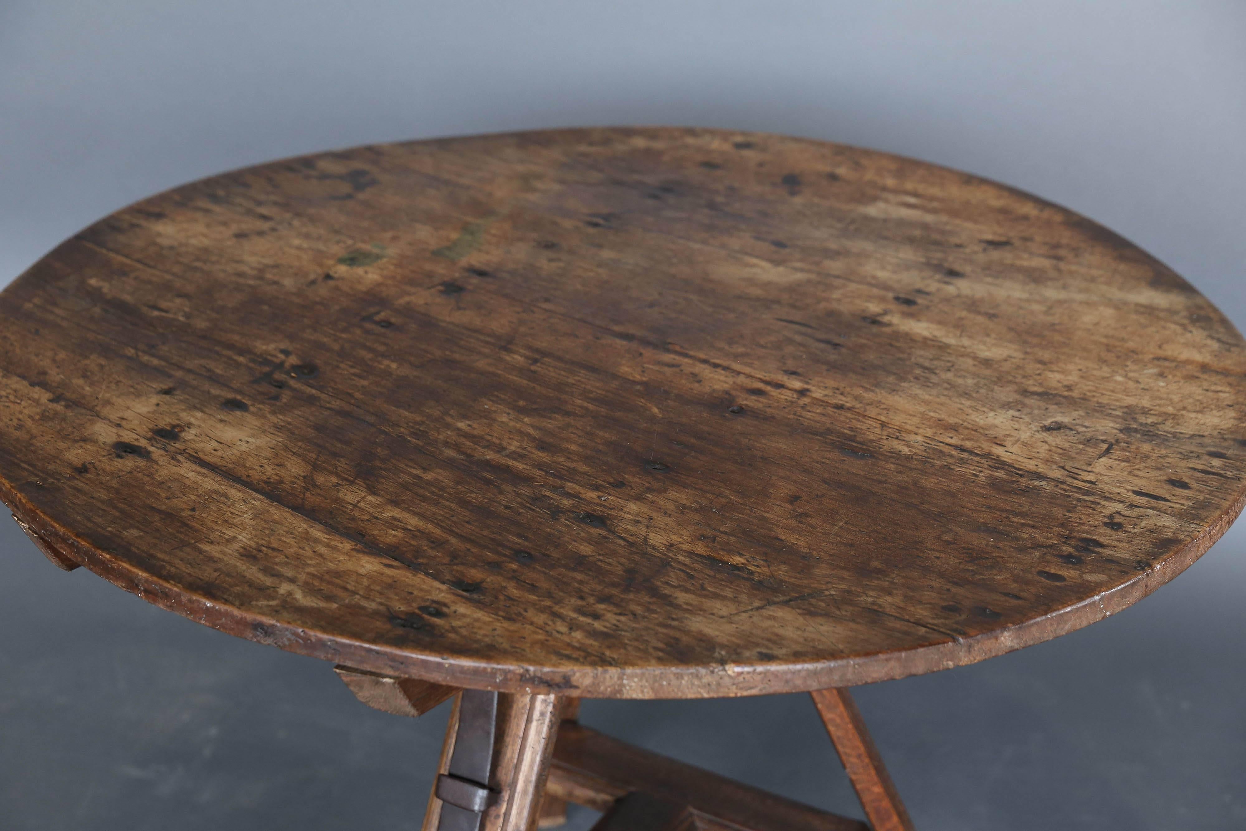 19th century round Dutch tripod table with hand-wrought original iron.