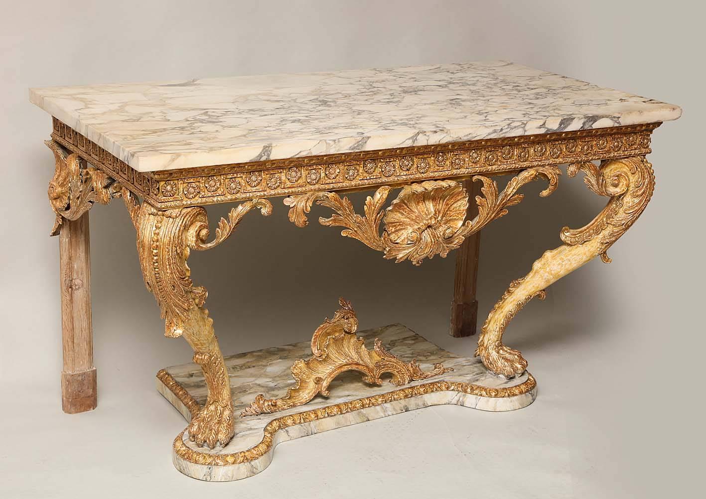 Very fine and important George II period console table, circa 1740, the Breccia Capraia marble top over egg and dart carved apron with rosettes in a Greek key border over shell and scroll carved frieze standing on muscular lion legs having beaded