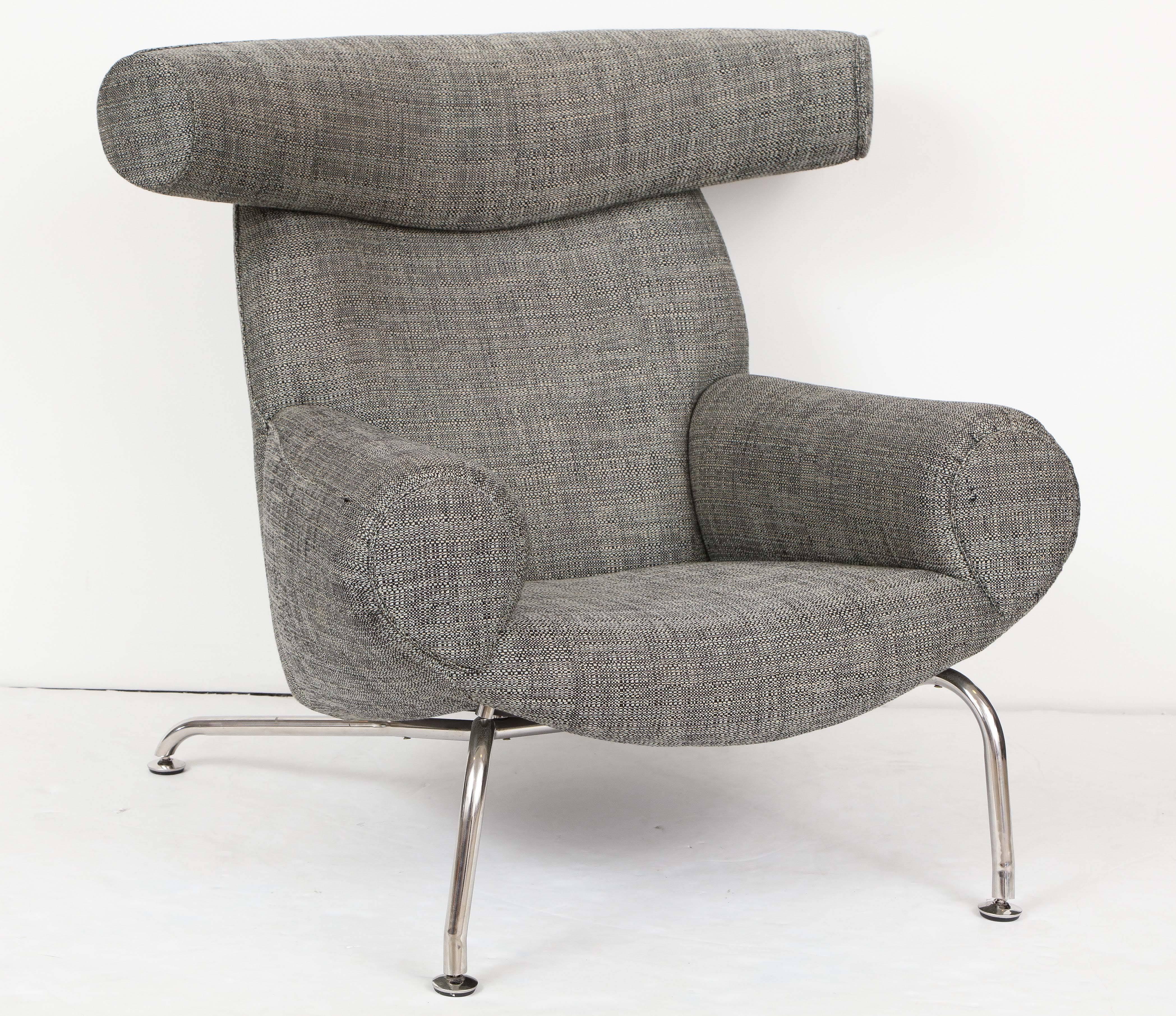A contemporary re-issue of the Ox chair by Hans Wegner for Erik Jørgensen, Denmark, circa 1990.

Fabric upholstery with polished chrome base. Recovered in Romo 