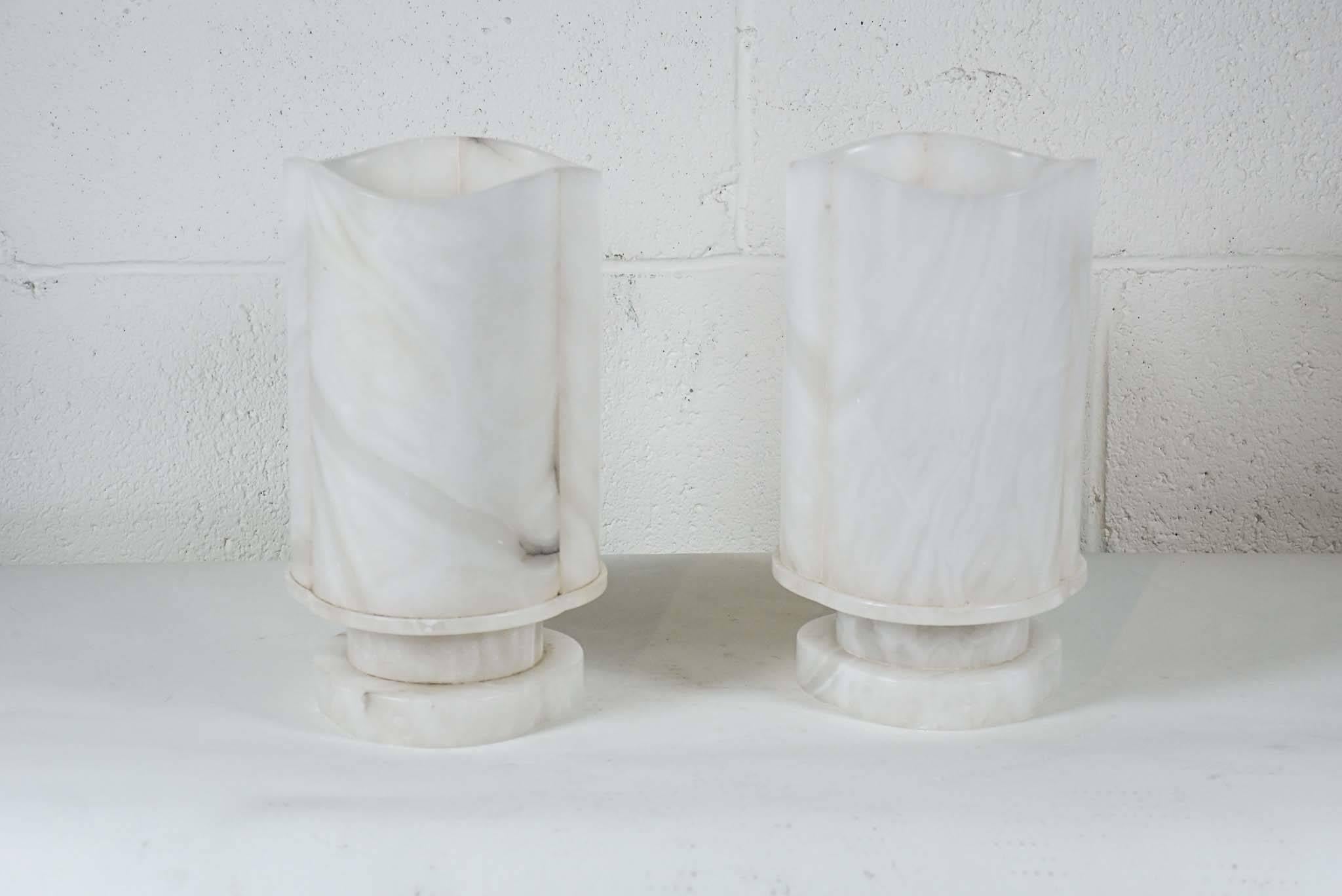 Here is a pair of elegant French Moderne Alabaster lamps with open tops.
 