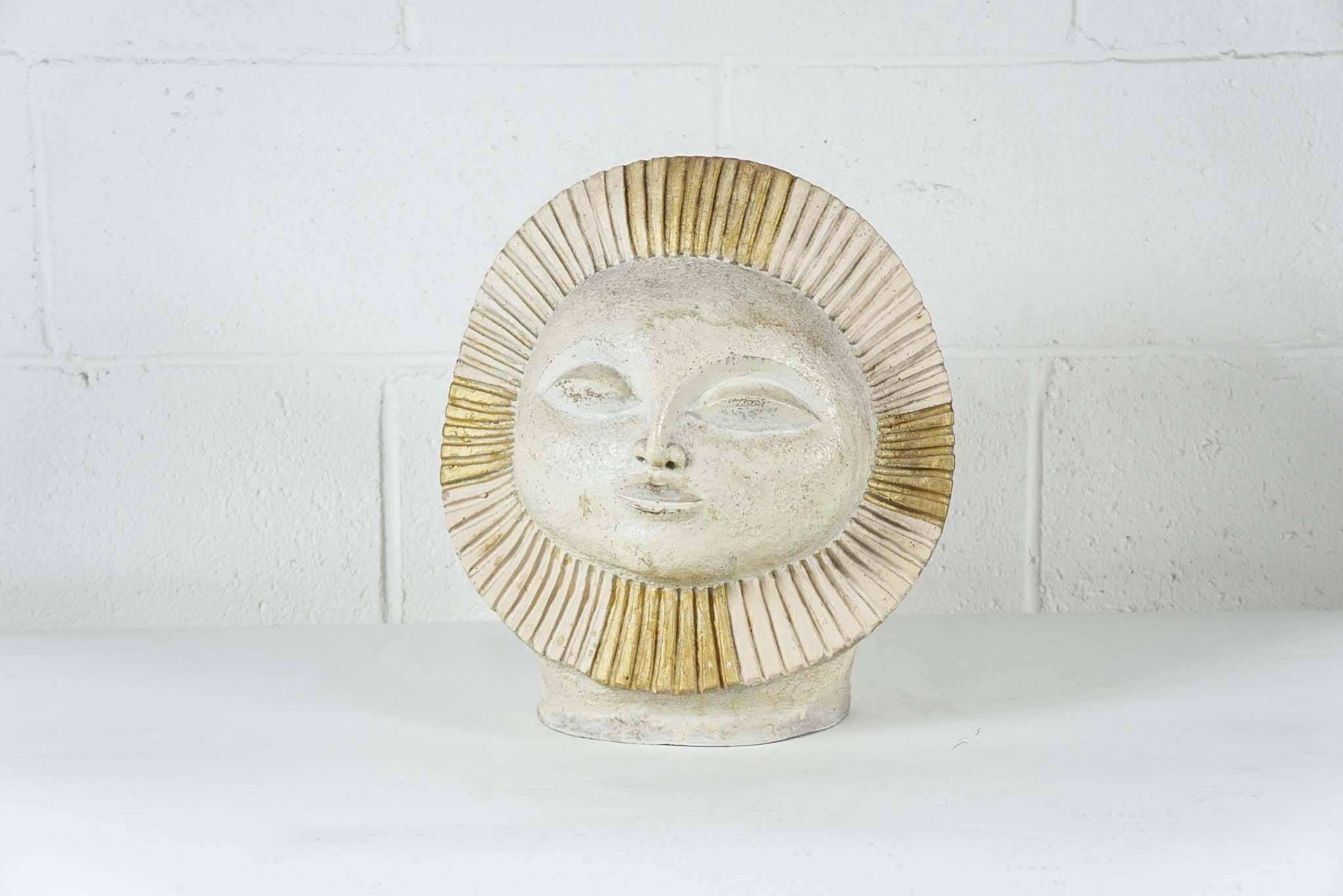 Here is a modern sculpture of a sun face in a textured ceramic with light gold accents. The sculpture is by Paul Ballardo incised with the marking Austin Ceramic Products, 1968.