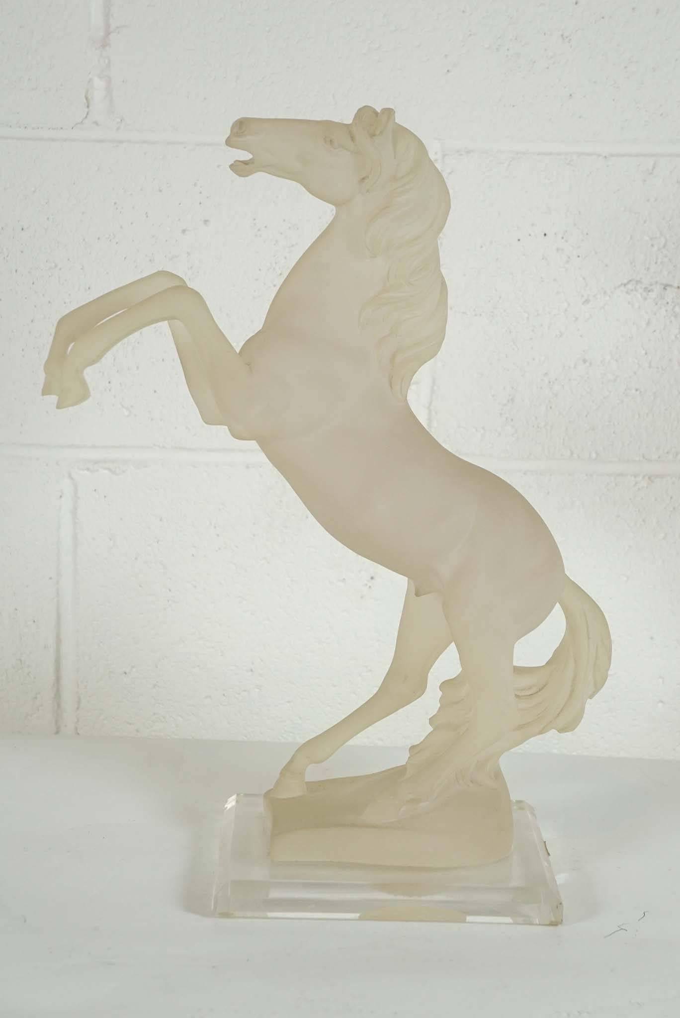 Here is a great horse sculpture in frosted Lucite with a clear Lucite base.
 