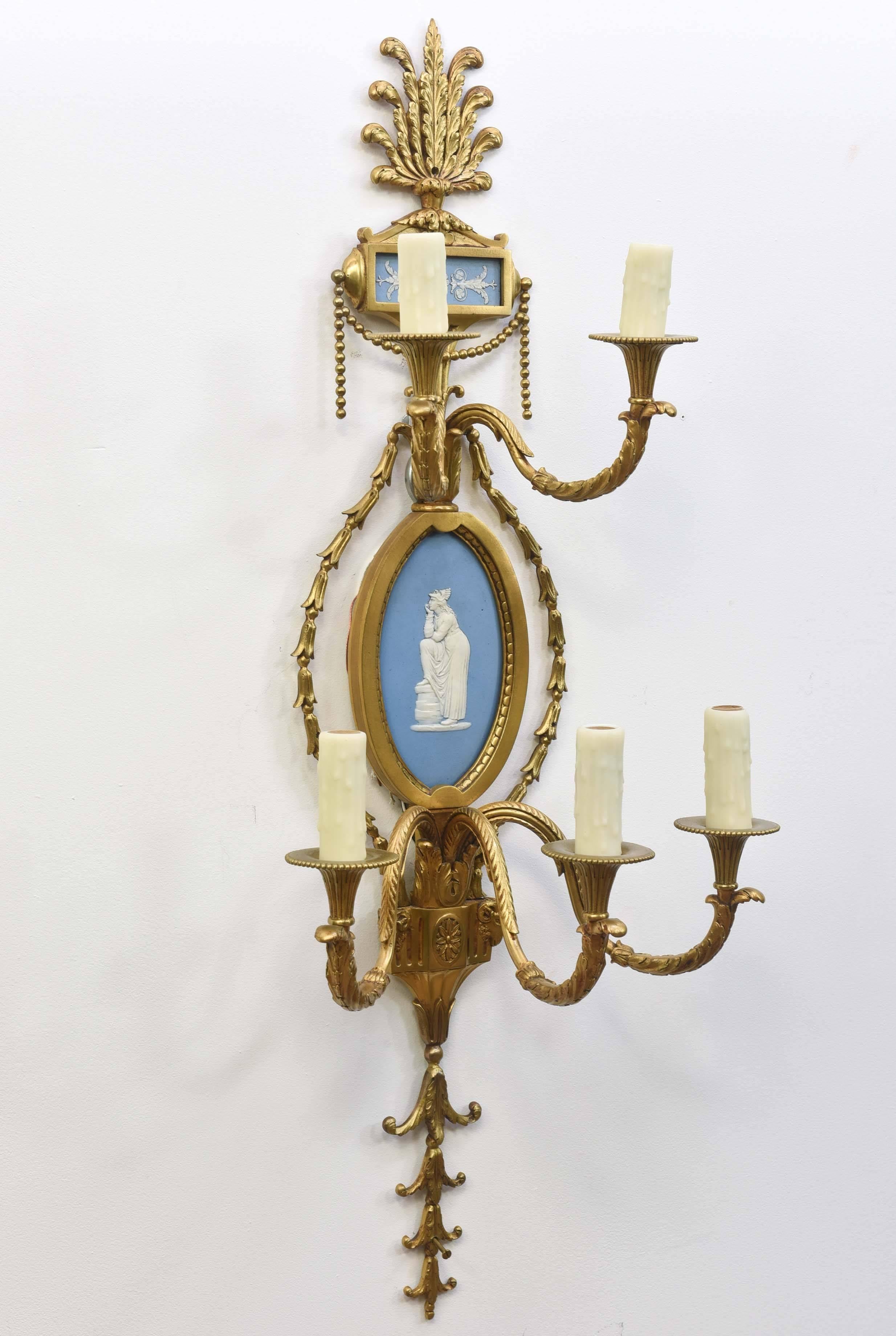 Pair of five-arm Wedgewood sconces, French style brass castings and Wedgewood plates. Newly rewired.