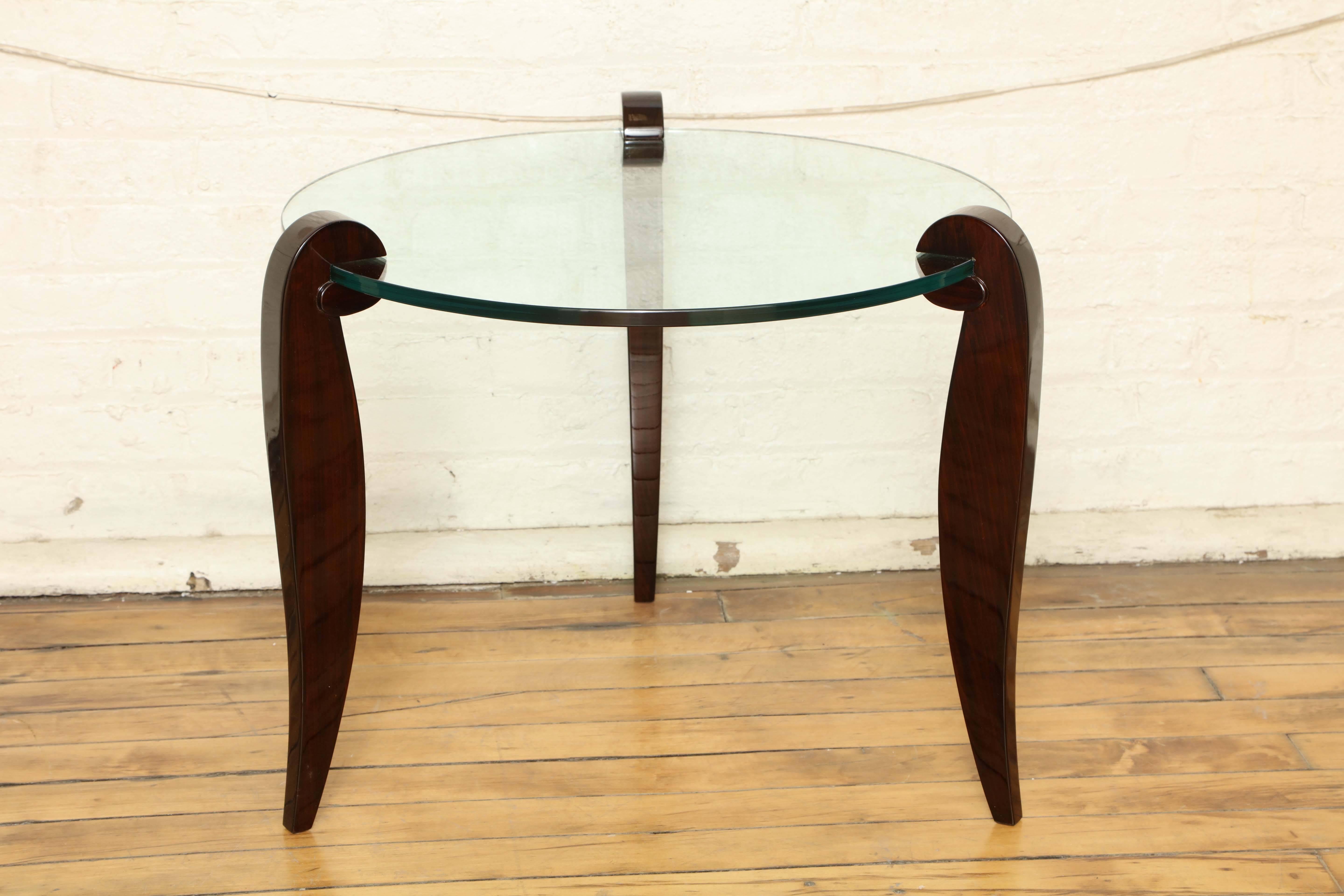 Chic Art Deco gueridon with glass top and Rio palissandre curved legs.