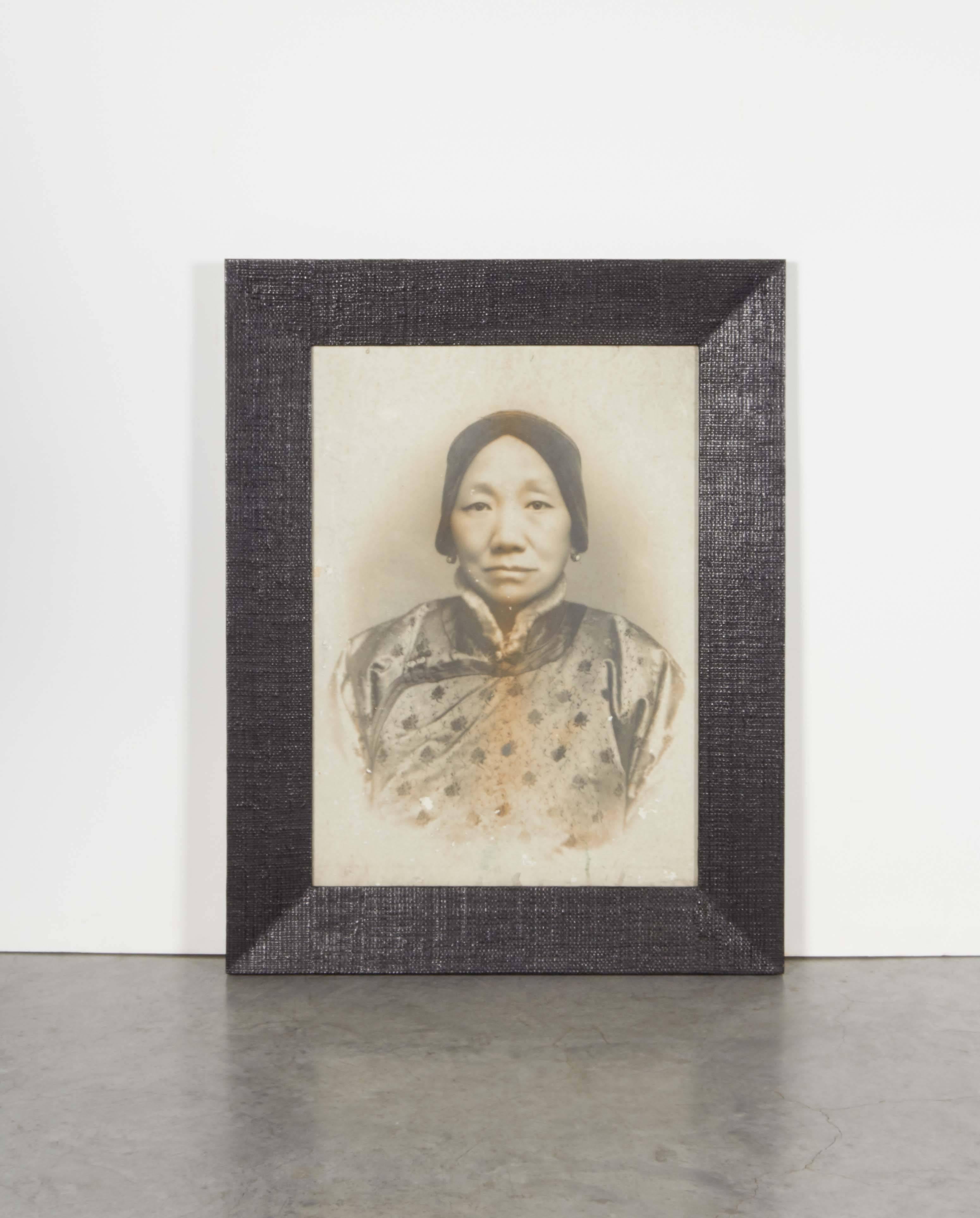 A beautifully framed, large-scale antique Chinese photograph of a woman in traditional garb. A striking image that holds your eye and conveys a piece of history,
P340.