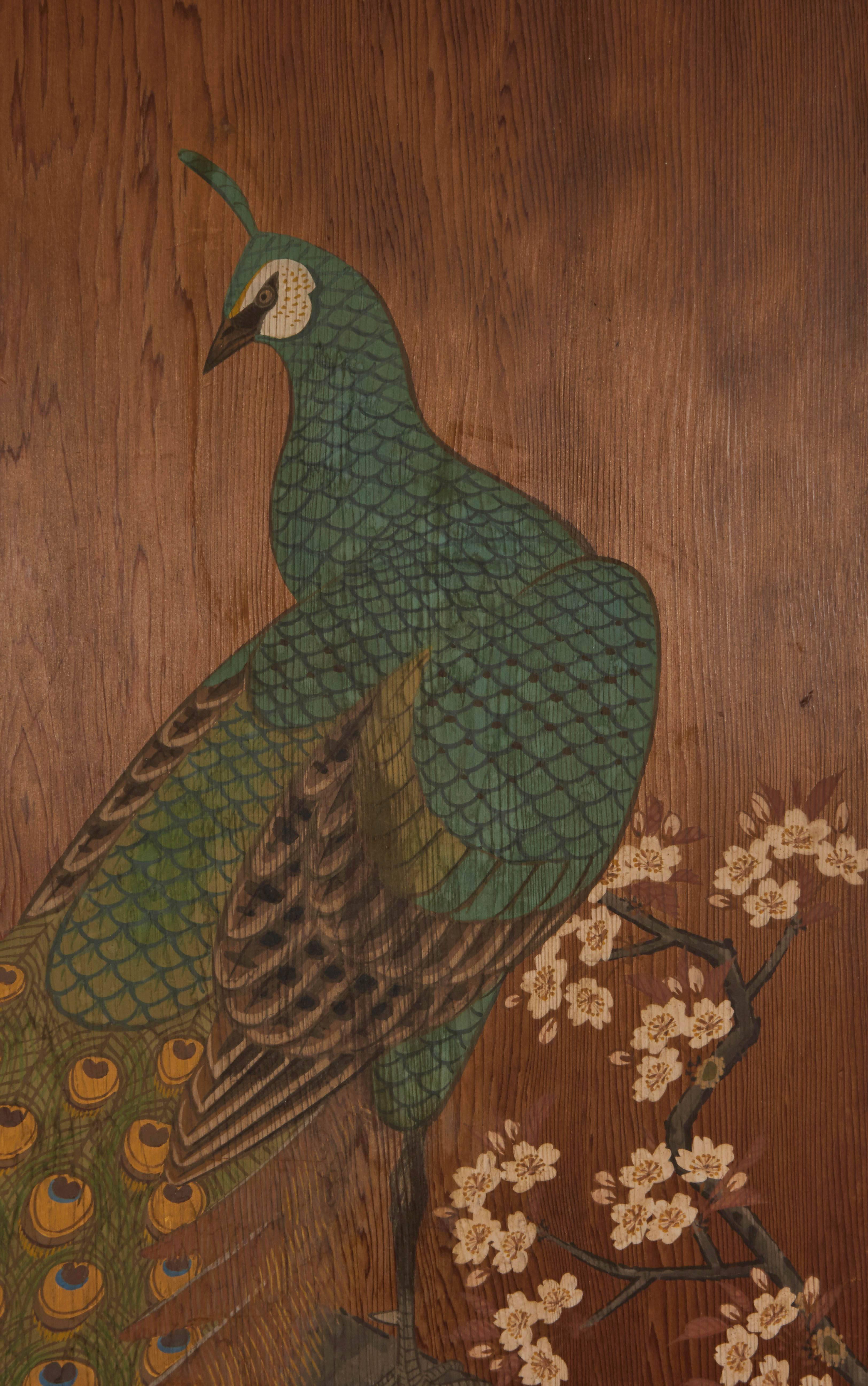 This Japanese painted wood door, originating from the Meiji period, circa 19th-early 20th century, comes decorated with peacock, perched on a flowering cherry tree branch, to the reverse, scatters of petals and dandelions. Marks include signature to