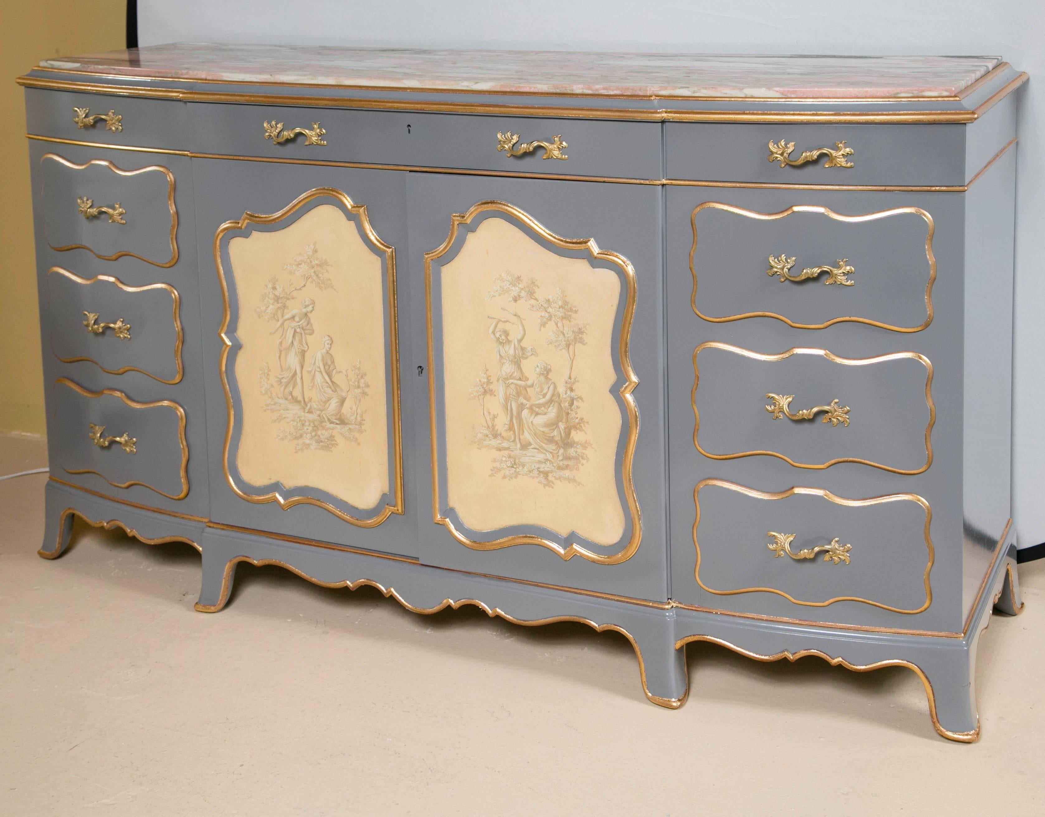 Venetian marble-top painted Hollywood Regency style sideboard. A one of a kind decorator sideboard in a fine gray and gilt gold hi light decorated look. The center door panels having painted scenes of lovers in a garden. The center doors flanked by