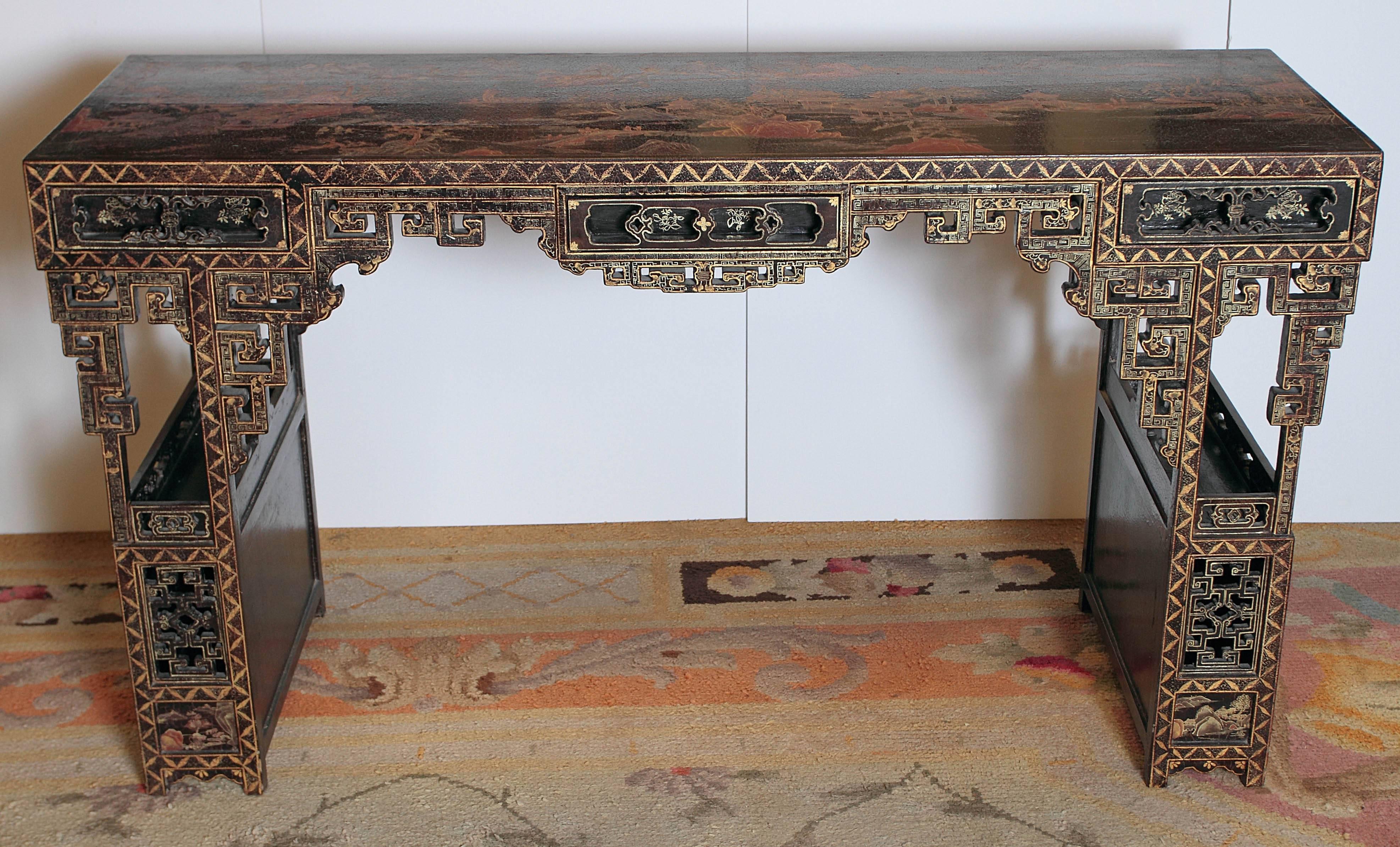 19th century Chinese lacquered console. Matched carving and drawers on both sides.