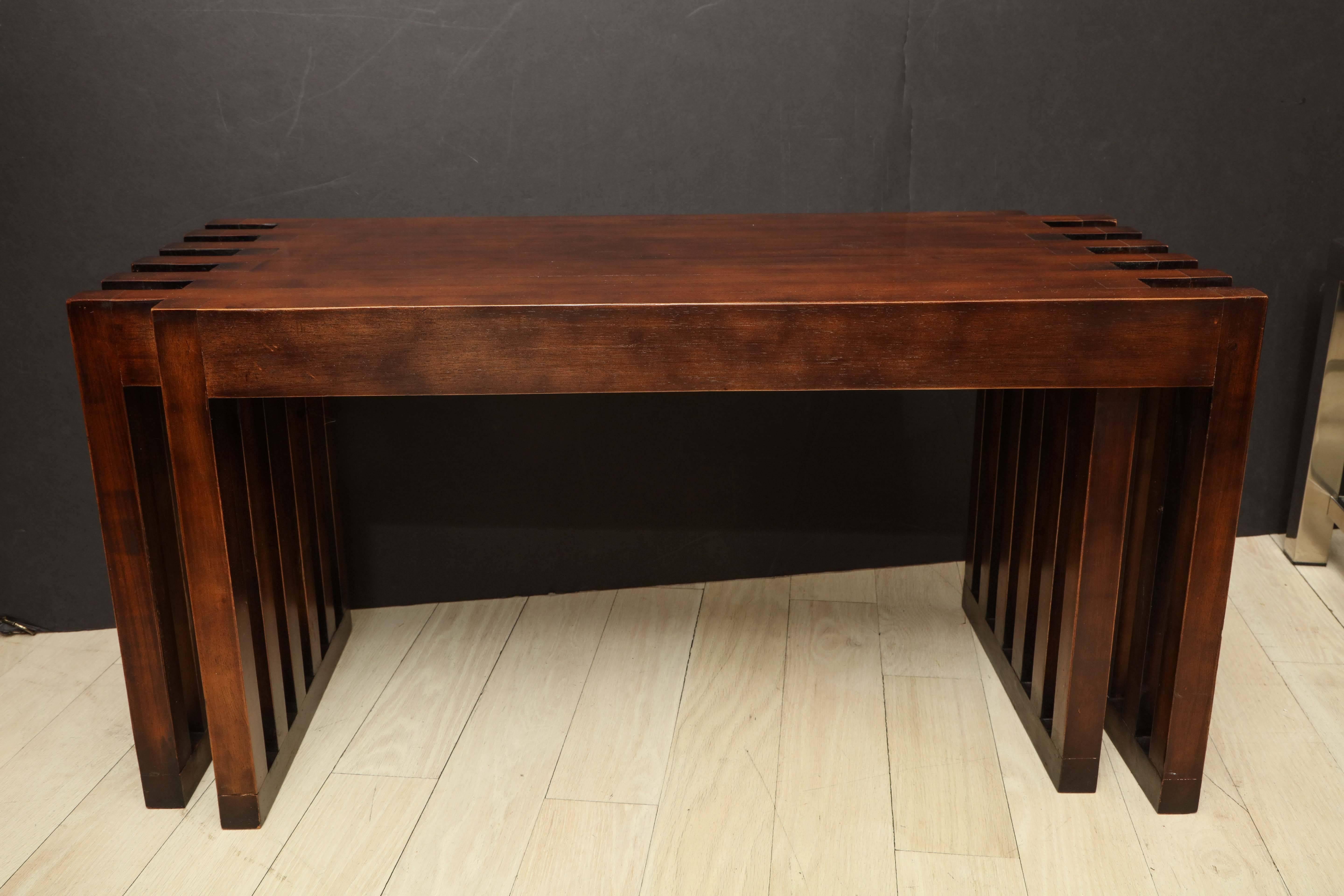 Pair of mahogany benches with double slatted side supports. Solid, sturdy benches that could also be used as two small wood tables.

Dimensions:
 36
