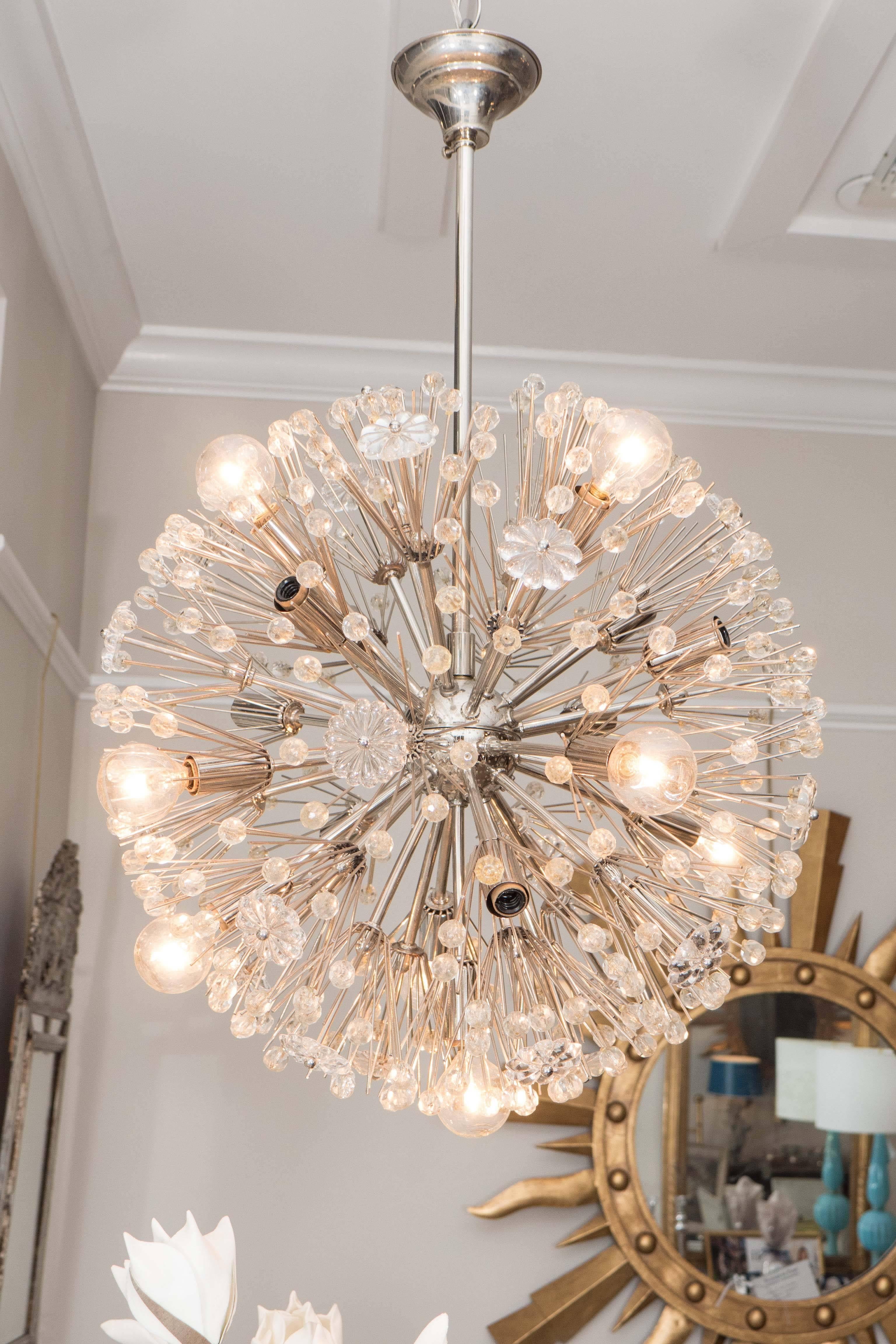 This beauty will light up the room! The sputnik ceiling fixture has twelve lights and is accented with round glass faceted beads and glass flowers, adding a touch of glamour and whimsy. The chandelier has a nickel-plated finish and has been re-wired