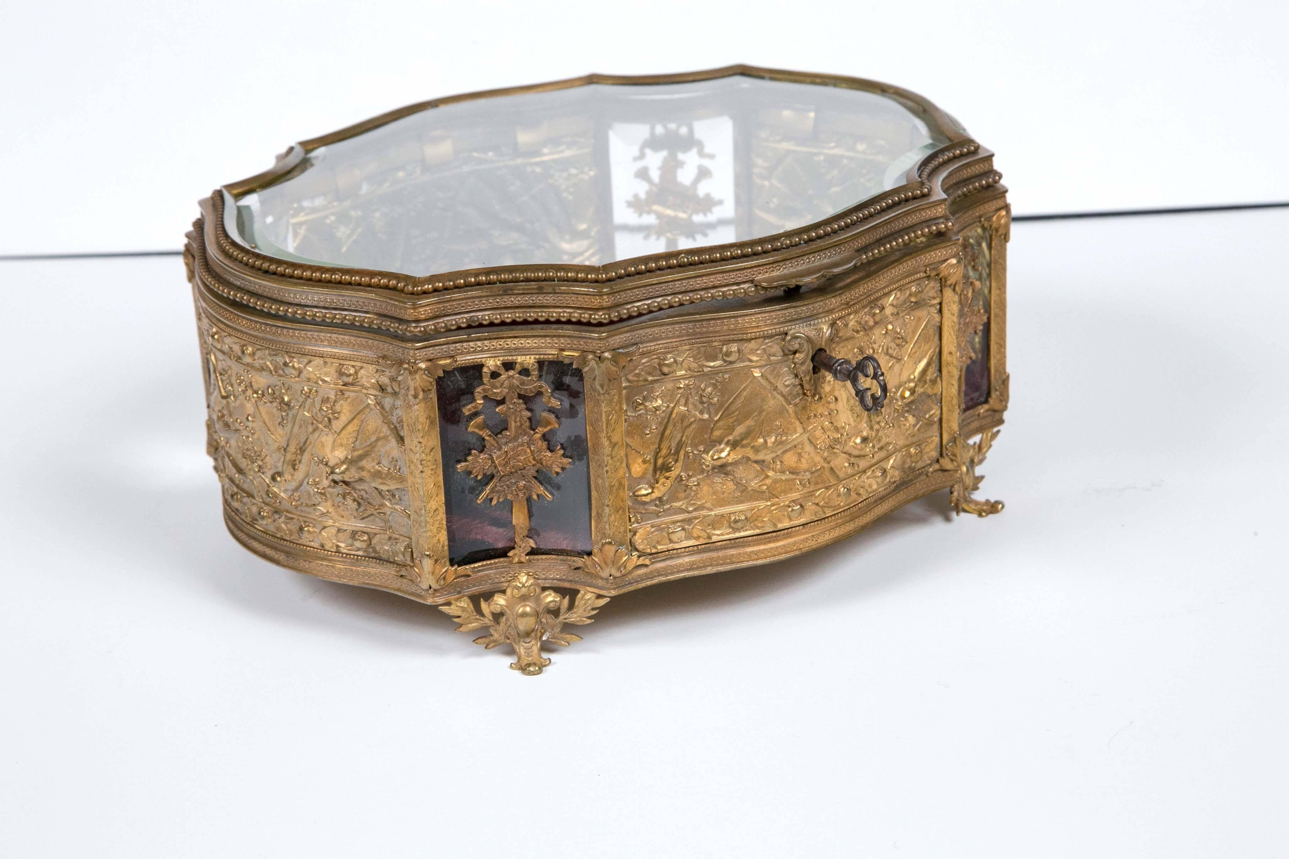 Antique French 1860 bronze beveled crystal box doré keepsake/ vitrine box in absolutely beautiful condition. We have acquired many antiques from a private collector. This box has is embossed with bows, swags, trumpets and birds.
Fleur-de-lis
