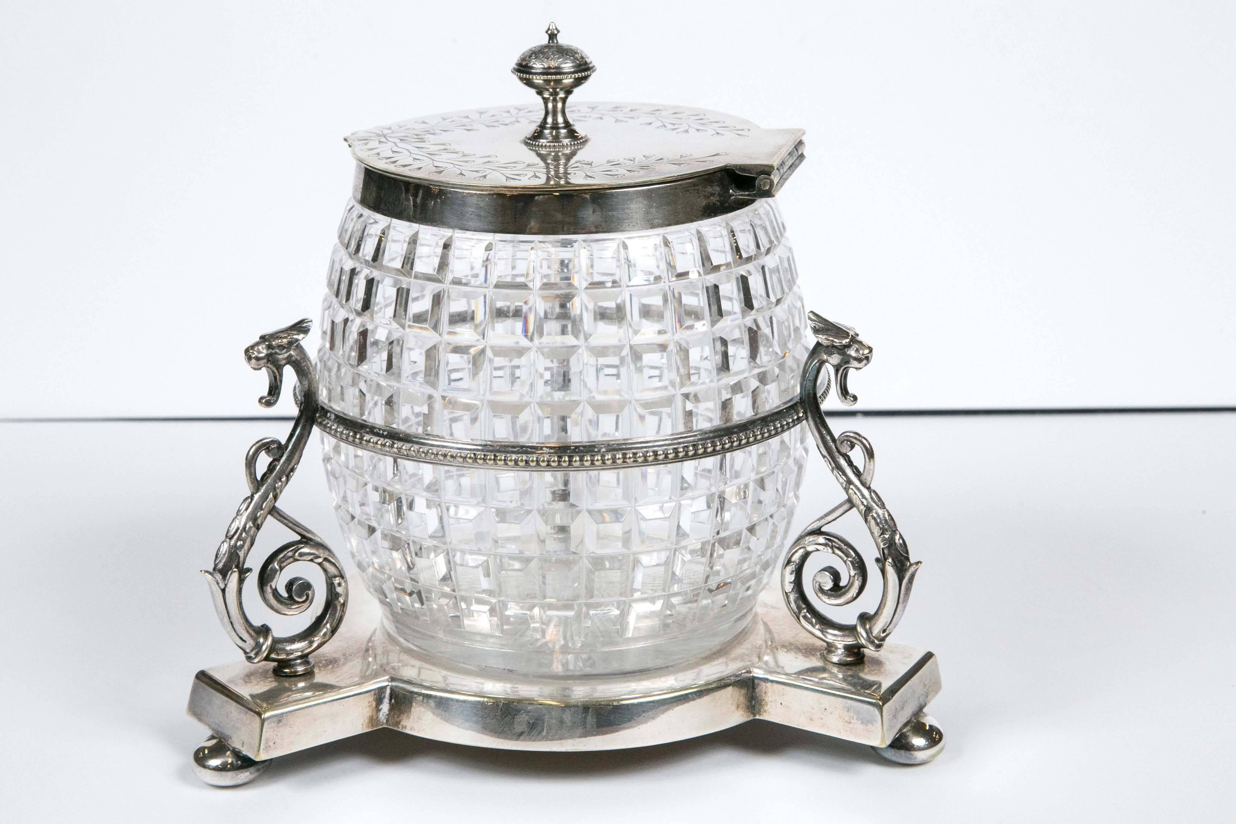 English 1860 crystal biscuit Jar with three serpents on silver plated stand.
This beautiful cut crystal biscuit jar has a brilliant diamond cut pattern.
One item from a large collection which we have acquired from a private collector.