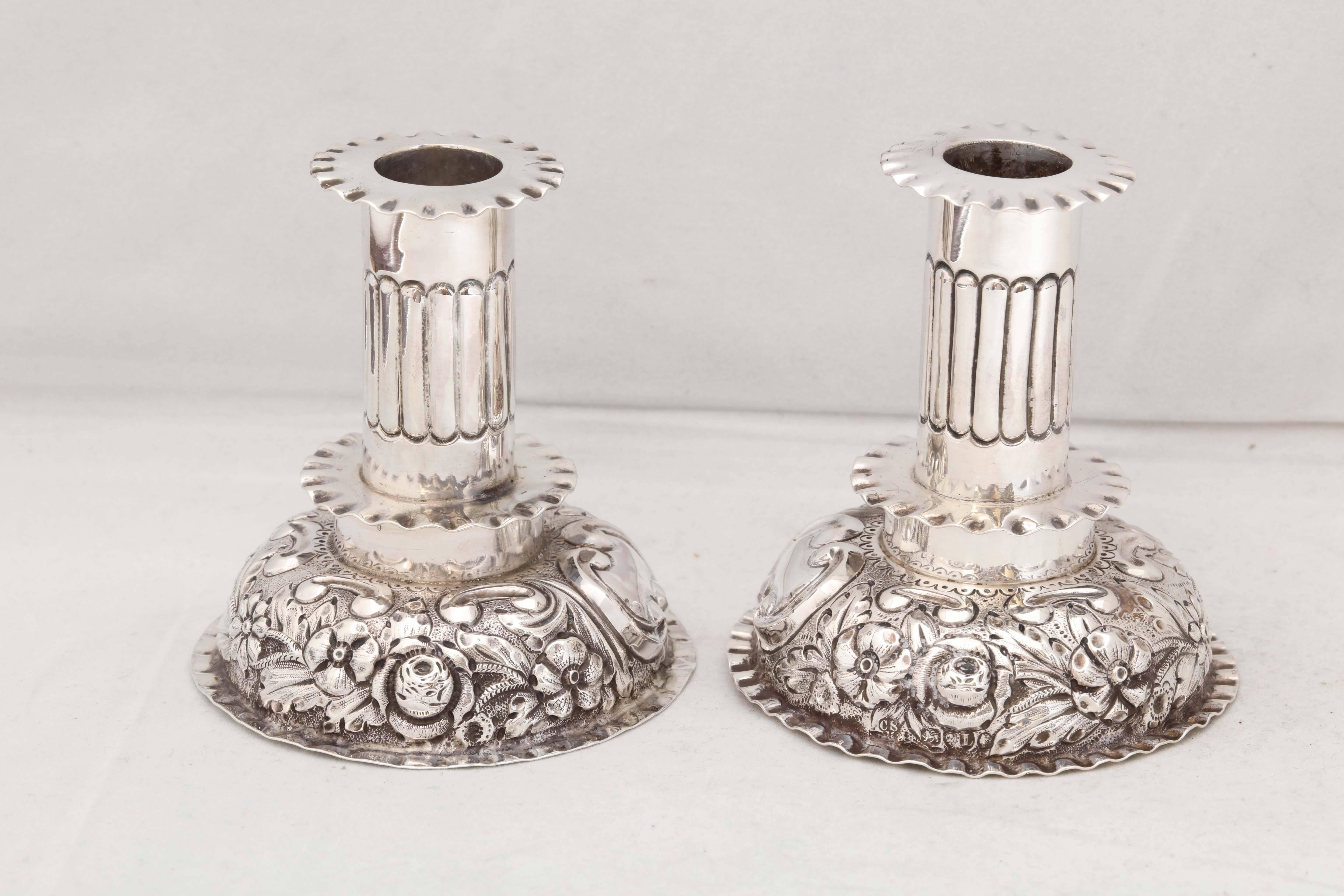 Pair of unusual, British, sterling silver, Victorian, Capstan candlesticks in the European style, London, 1886, Charles Stuart Harris - maker. Removable bobeches; vacant cartouche on each. Measures: 3 3/4