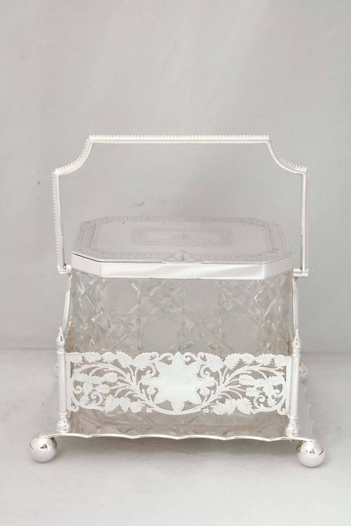Beautiful, Victorian, hobnail-cut crystal biscuit barrel on original Sheffield plated stand, Sheffield, England, circa 1870, Cooper Bros. & Son, Ltd.- makers. Hinged lid. Stand measures 9 1/4 inches high (when handle is in raised position) x 8