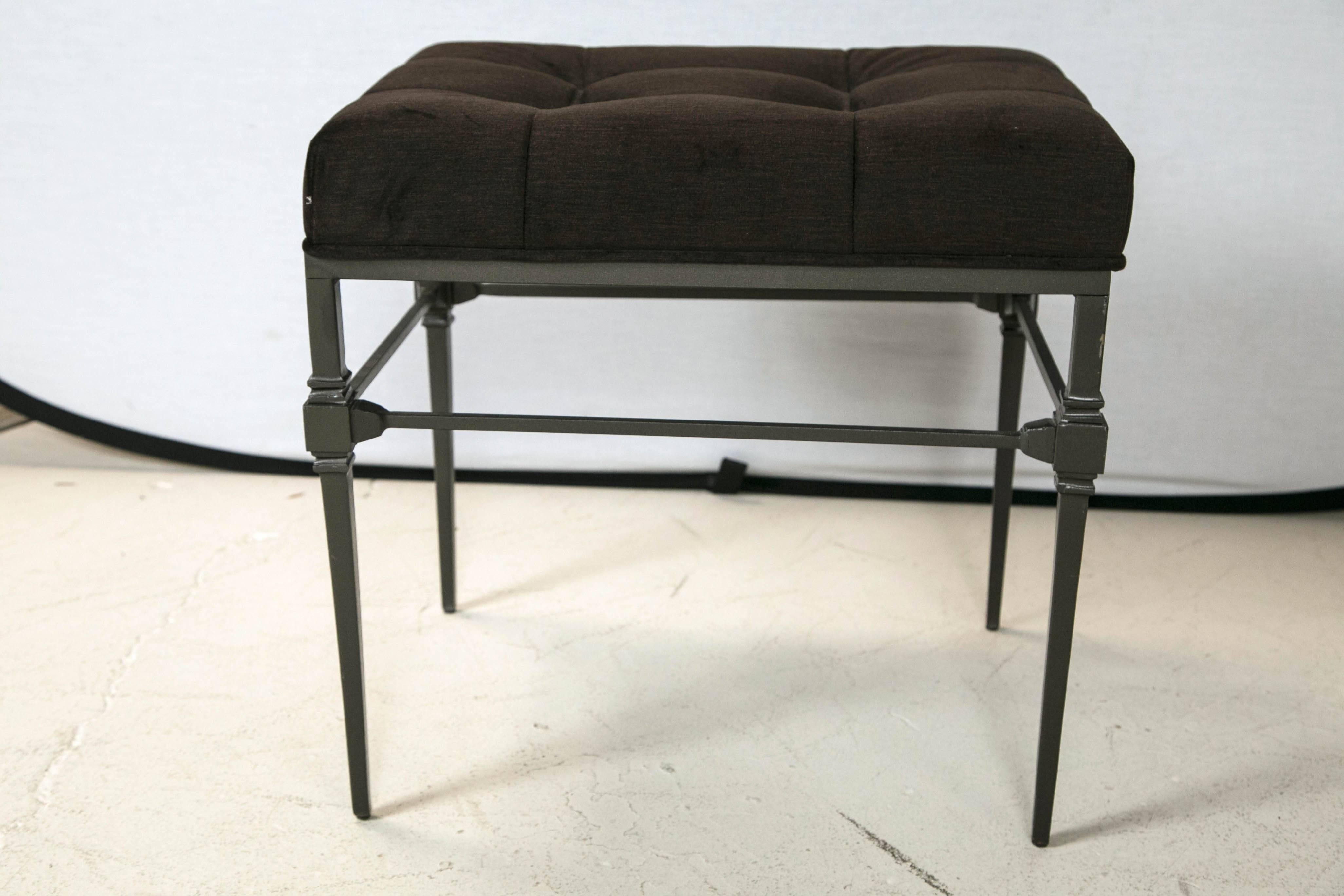 Pair of wrought iron benches or stools in the neoclassical style. Tufted seats in dark brown velveteen.