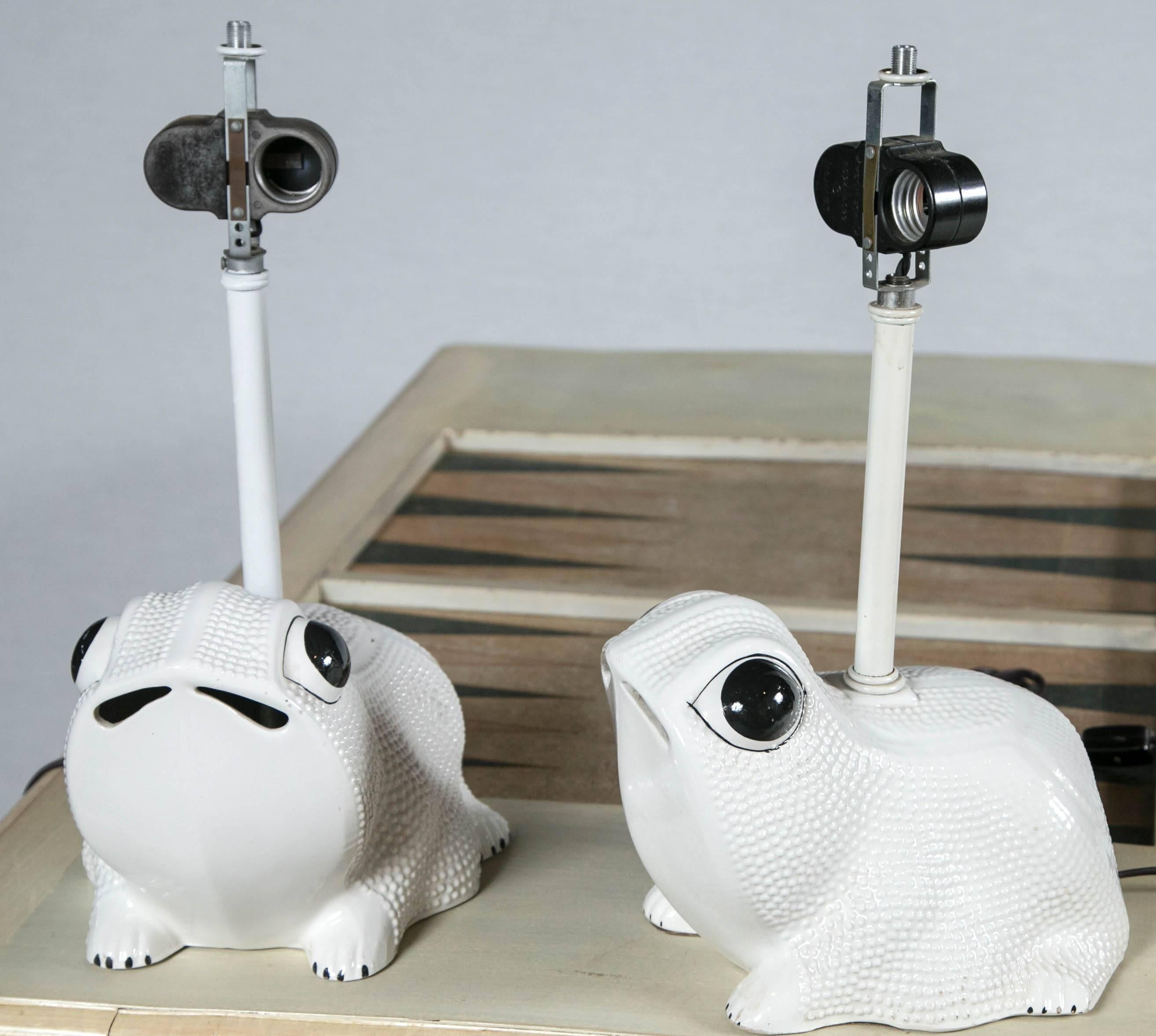 Pair of white ceramic frog lamp bases from Italy.