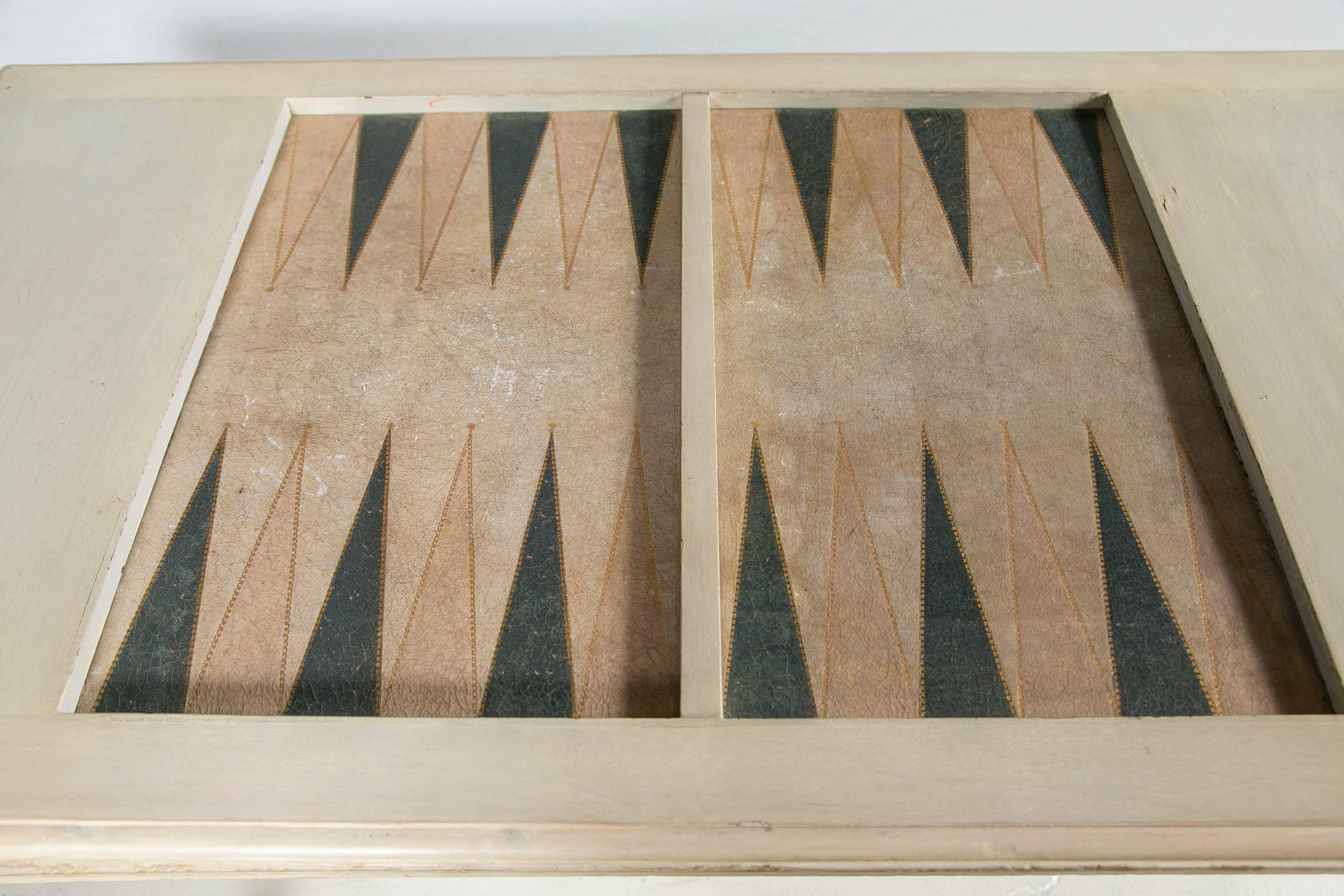 Antiques white wooden backgammon game table with leather insert. Includes wooden pieces and dice cup.