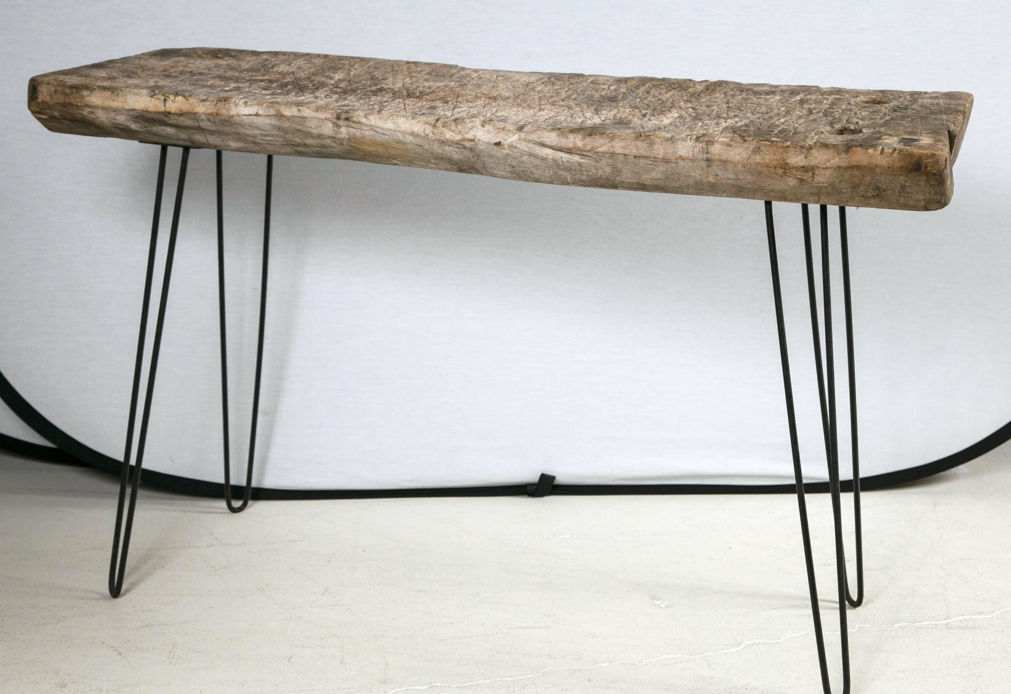 Unusual Primitive wooden top console with hand chamfered sides set on modern hairpin iron legs.