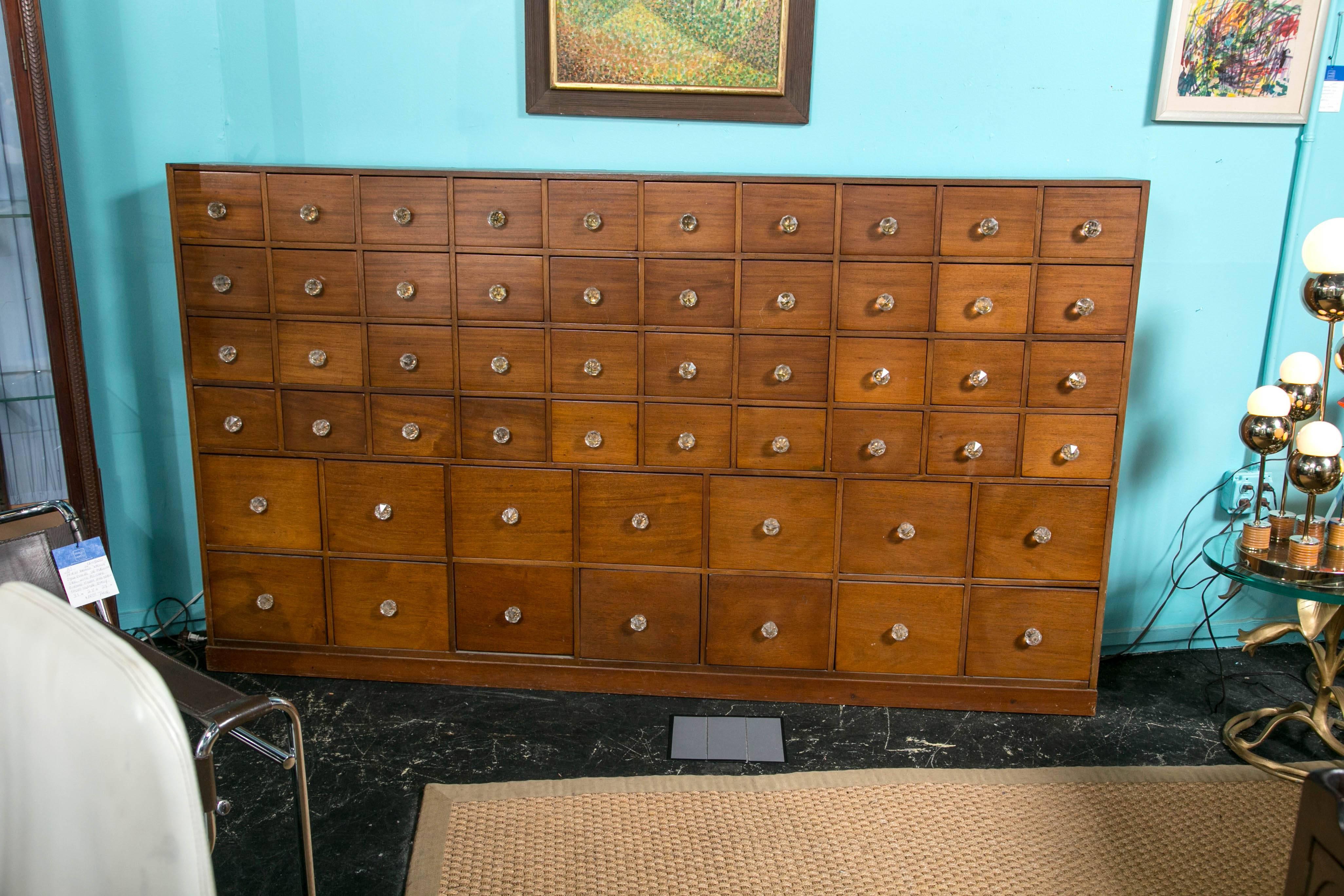 A mahogany, 19th century apothecary chest with 54 drawers, graduated from small to large. Original glass pulls, made by Johnson M.P.S. Prestwich.