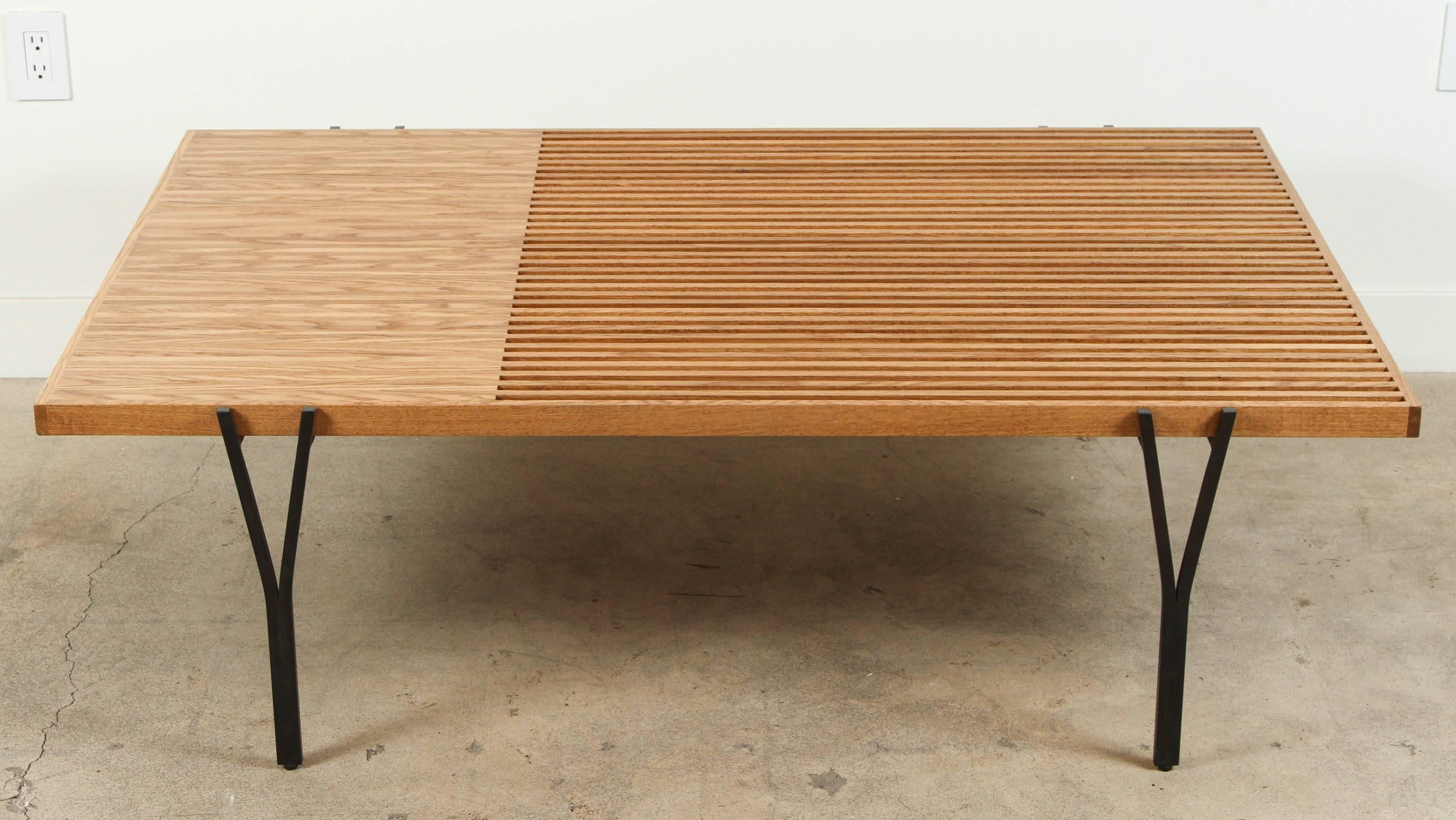 The Y-Leg Coffee Table top is composed of solid American walnut or white oak strips. Both ends of the table have visible dowel joinery which adds to the handcrafted feel and the strength of the table. The base is plated steel with levelers on the