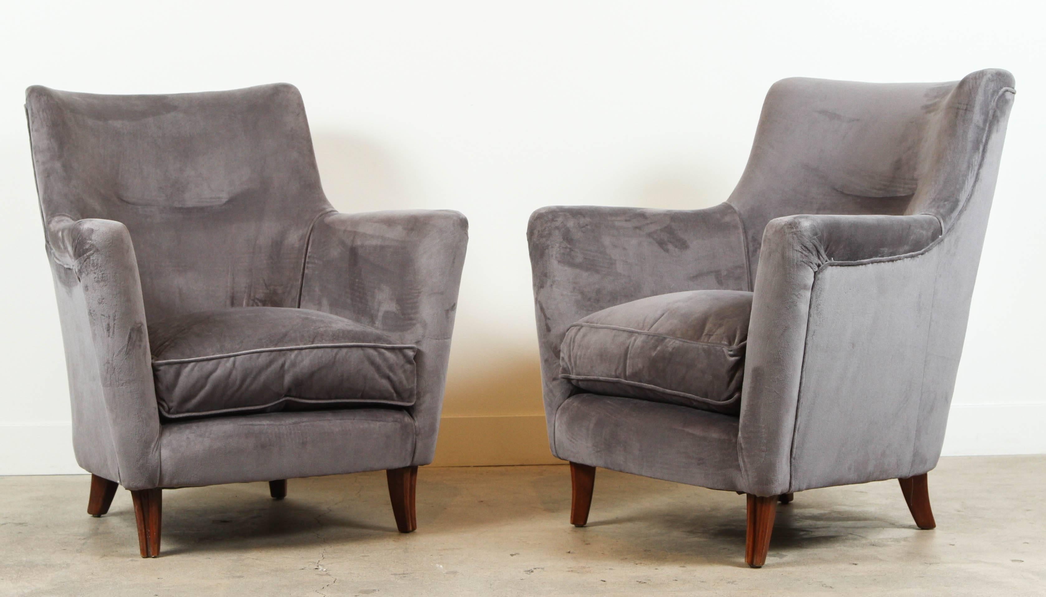 Pair of club chairs in the style of Paolo Buffa.