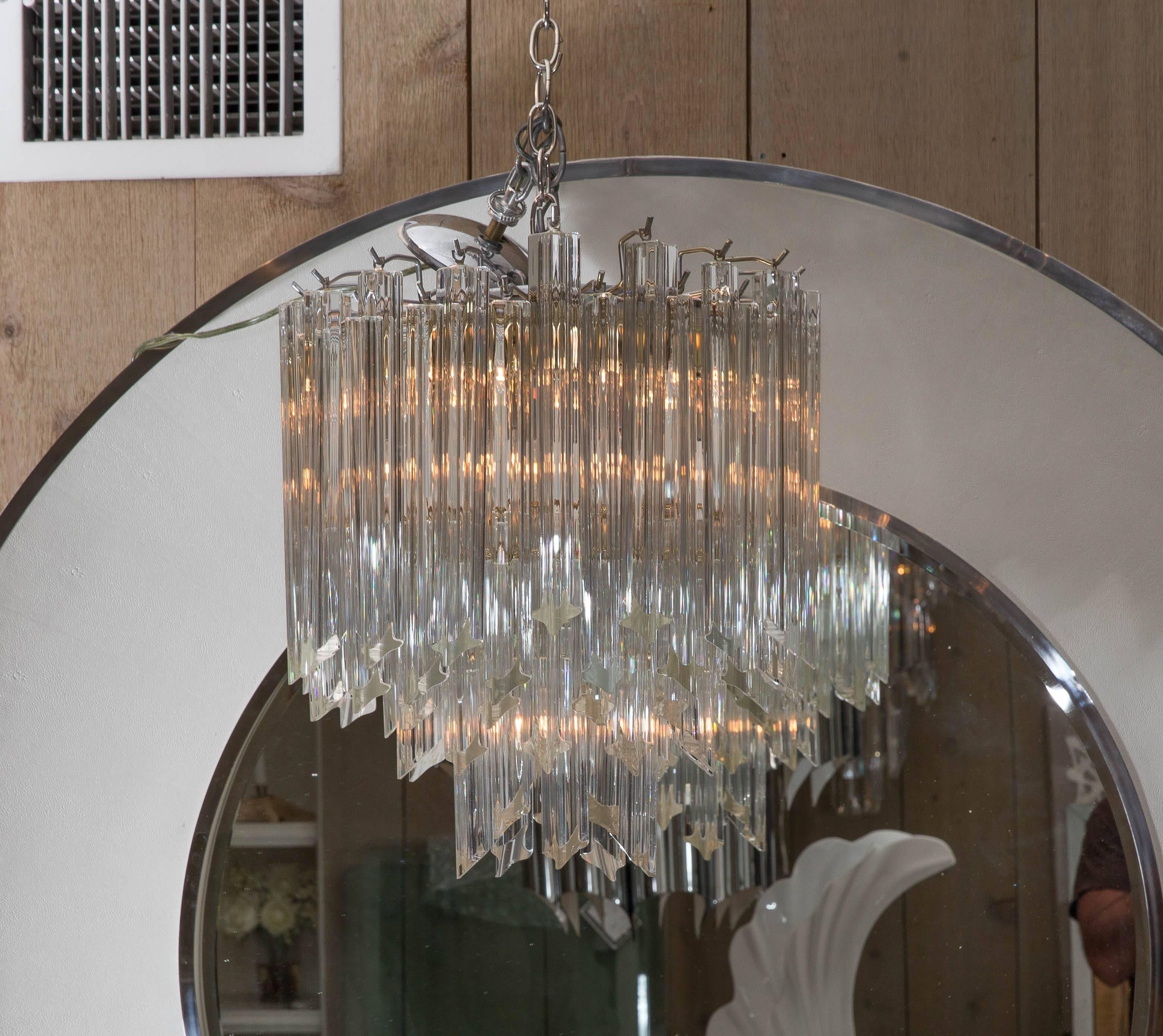 Attractive Mid-Century round silvered metal chandelier with glass hanging pendants.