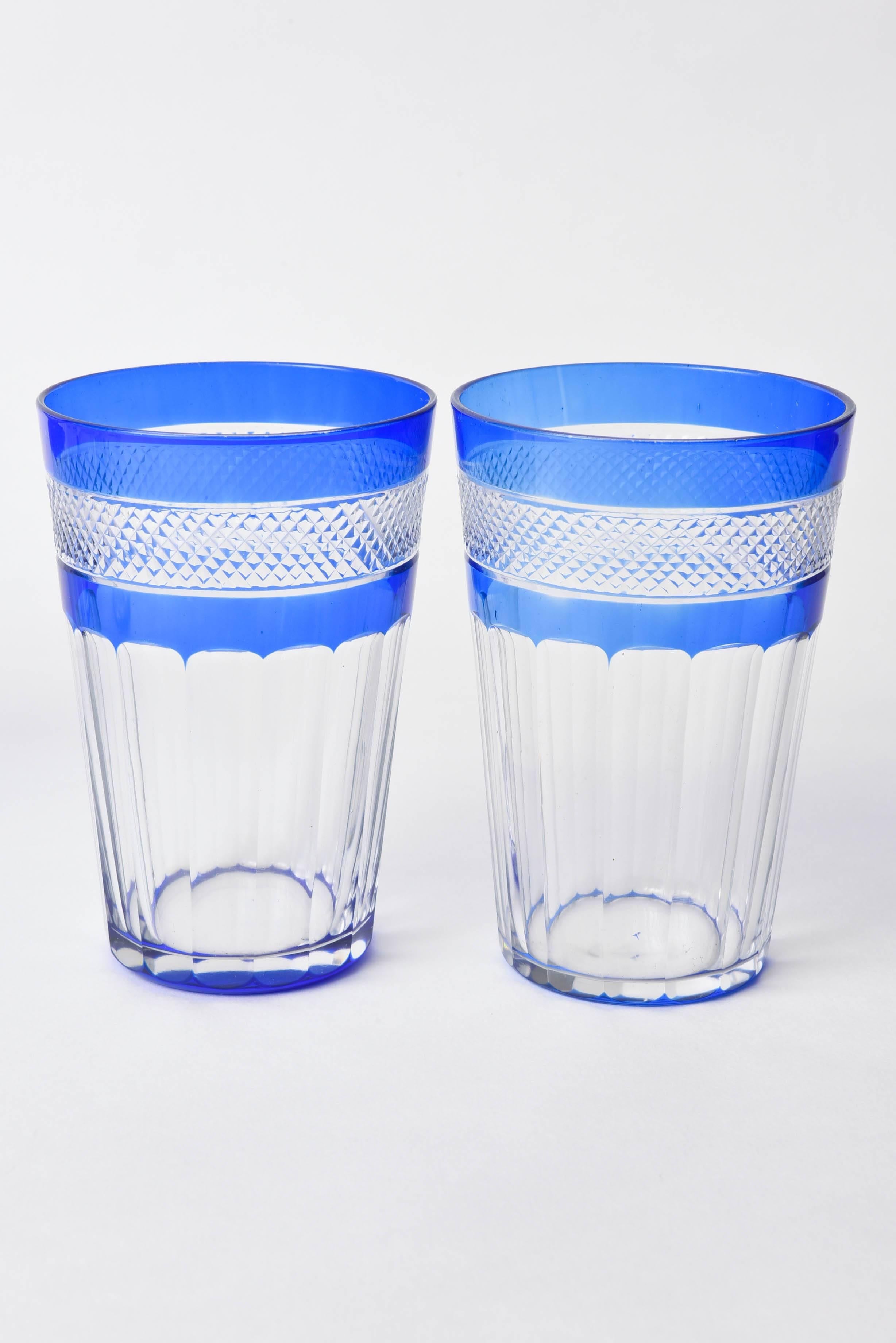 A great set with super cobalt blue color. Please note the extra cased blue glass even on the base of these tumblers. Elongated thumbprint and cross diamond hatch pattern enhance these practical bar or water glasses. While not signed as they are