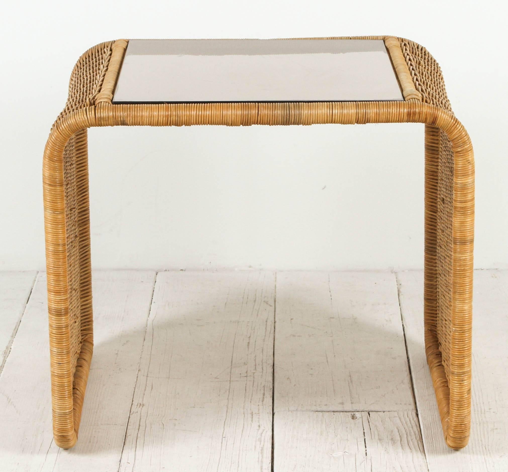 Vintage rattan and glass waterfall side table.