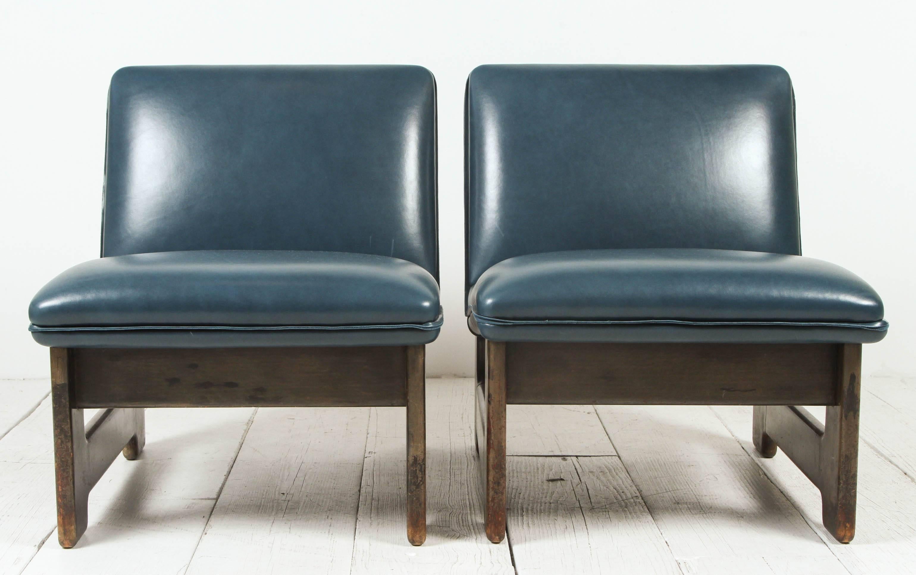 Pair of Italian wood framed chairs upholstered in navy blue leather.