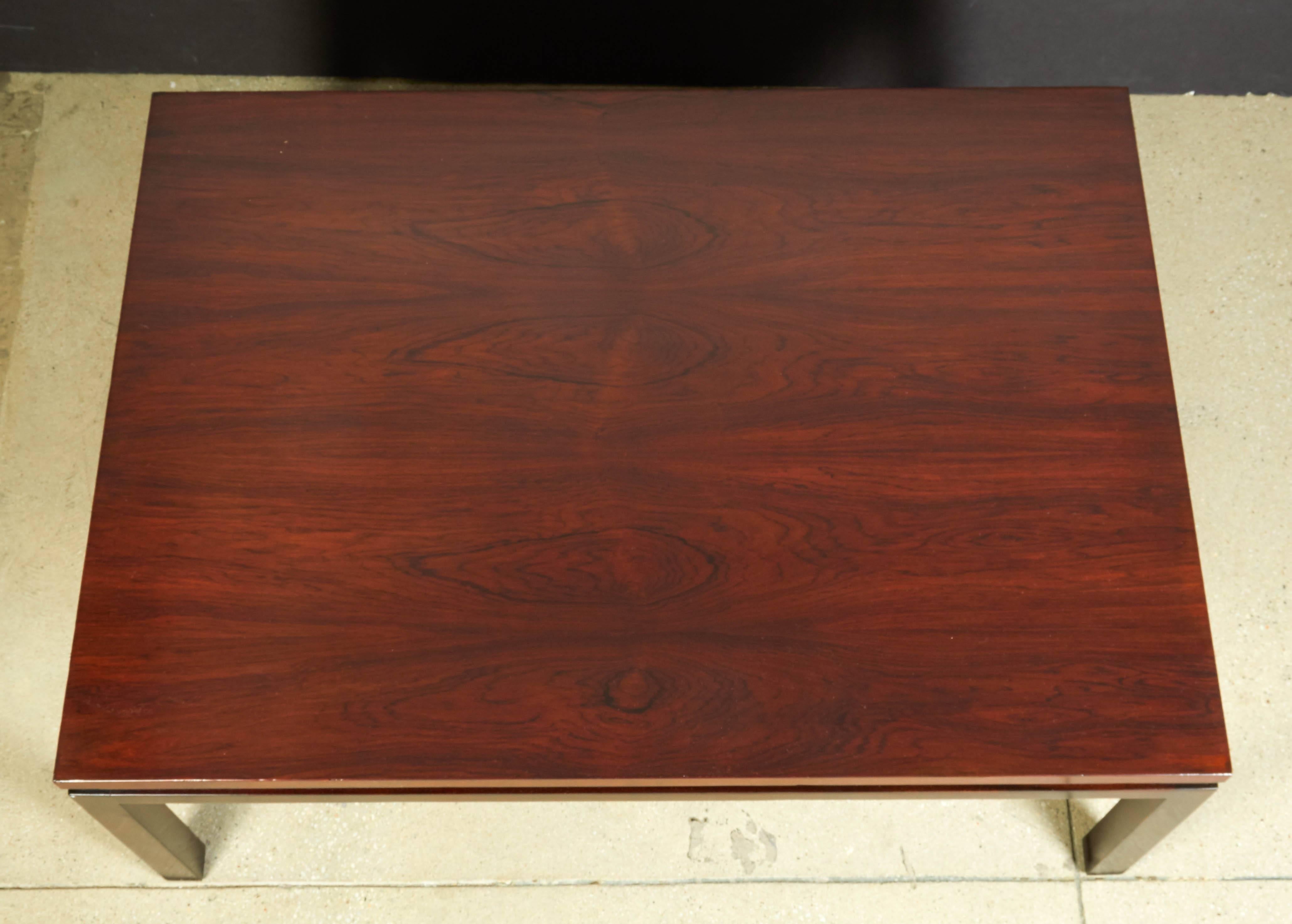 Rosewood top coffee table with dark walnut finished base, circa 1960, in the manner of Harvey Probber.