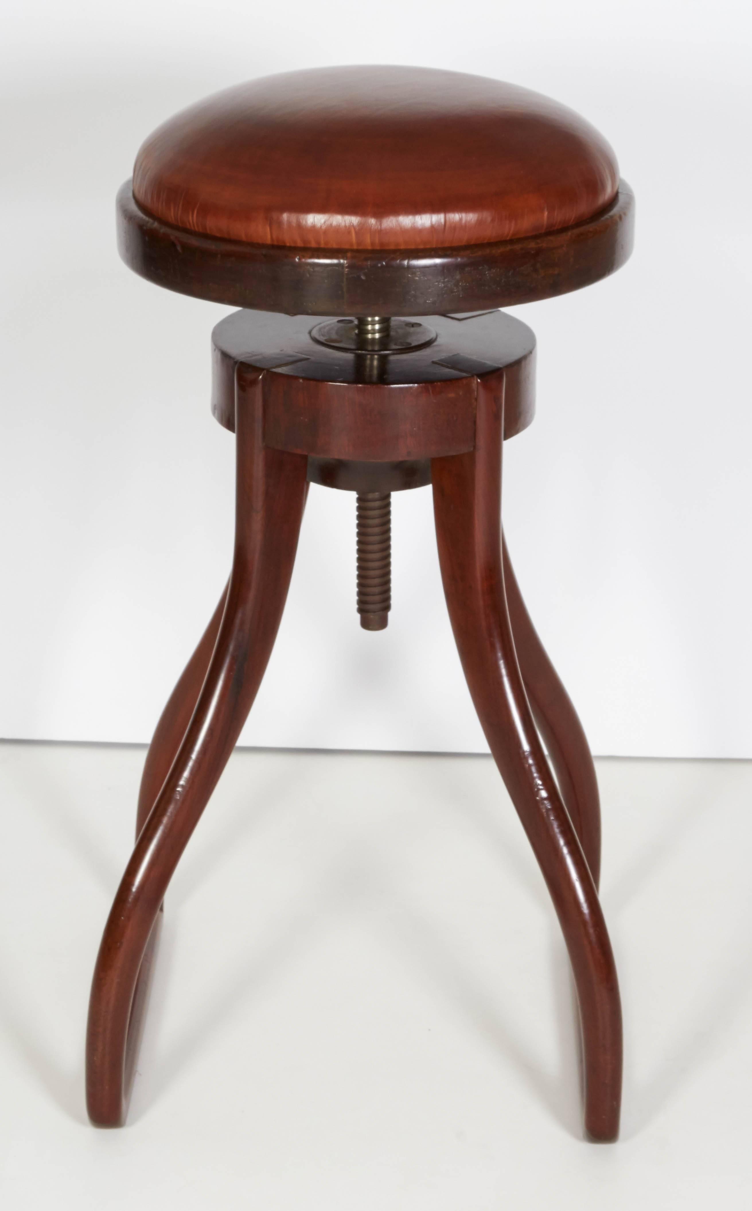 A Danish mahogany and leather upholstered adjustable drafting stool, late 19th century.

Height is adjustable from 29in to approximate 35in. and is very sturdy.