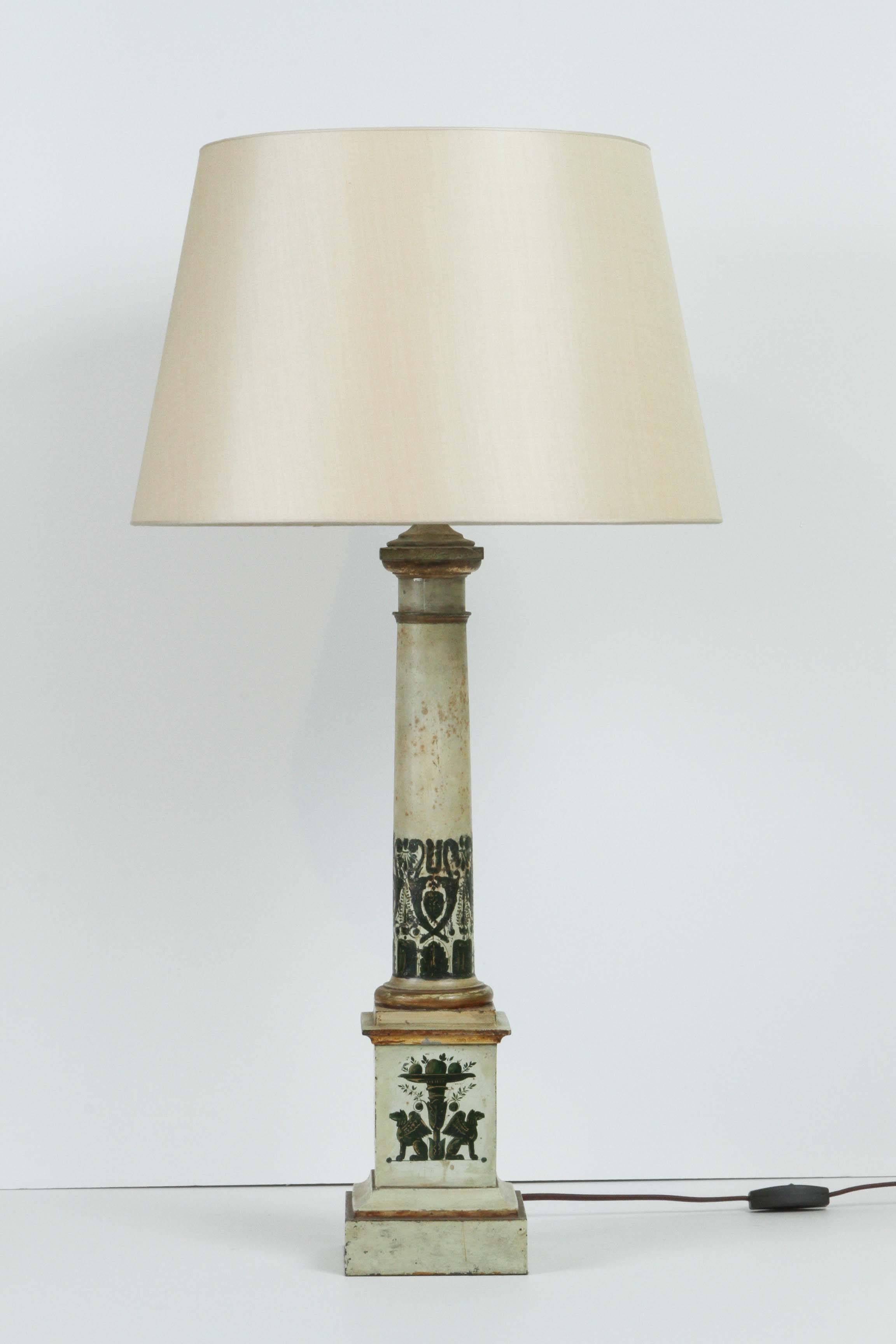 A pair of French painted tole lamps in cream and green, early 20th century, with custom silk pongee shades.