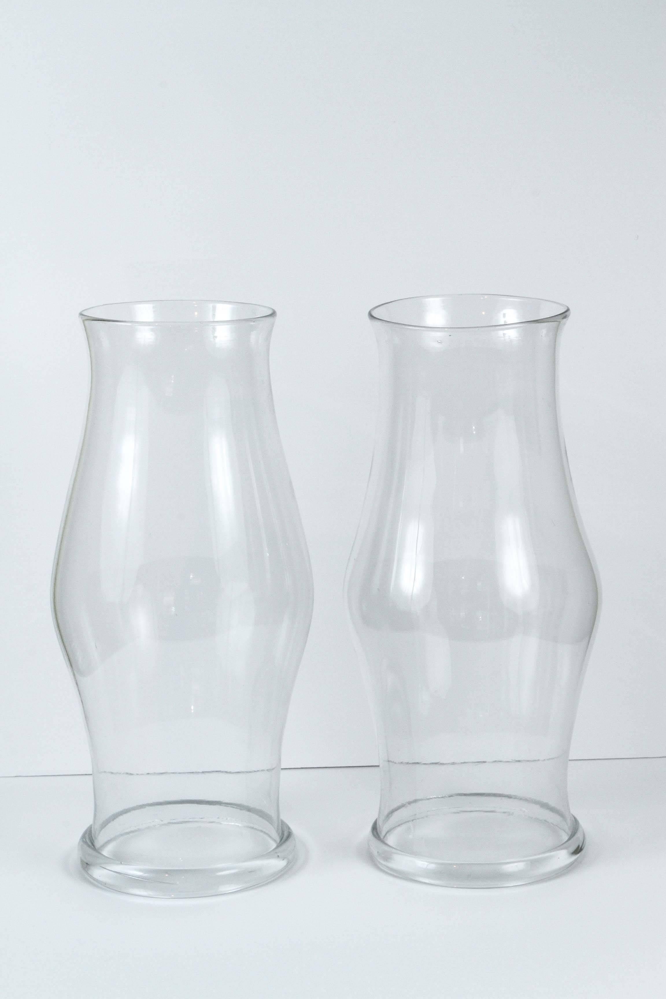 A pair of baluster form, handblown hurricane shades with molded foot rims, 19th century.