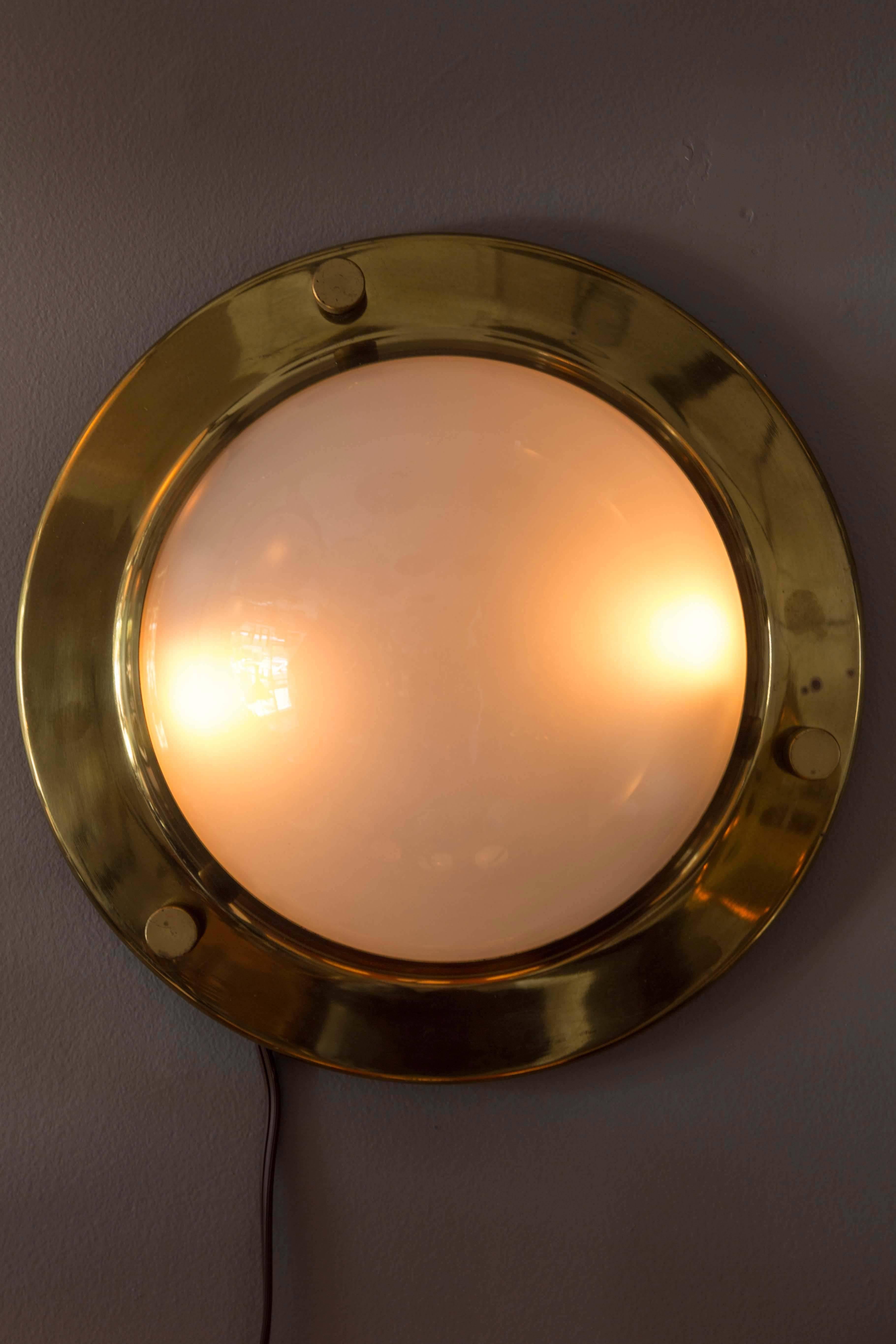 1960s Luigi Caccia Dominioni 'LSP6' Wall or Ceiling Light for Azucena. An iconic design executed in patinated brass and opaline glass, Italy, circa 1965.