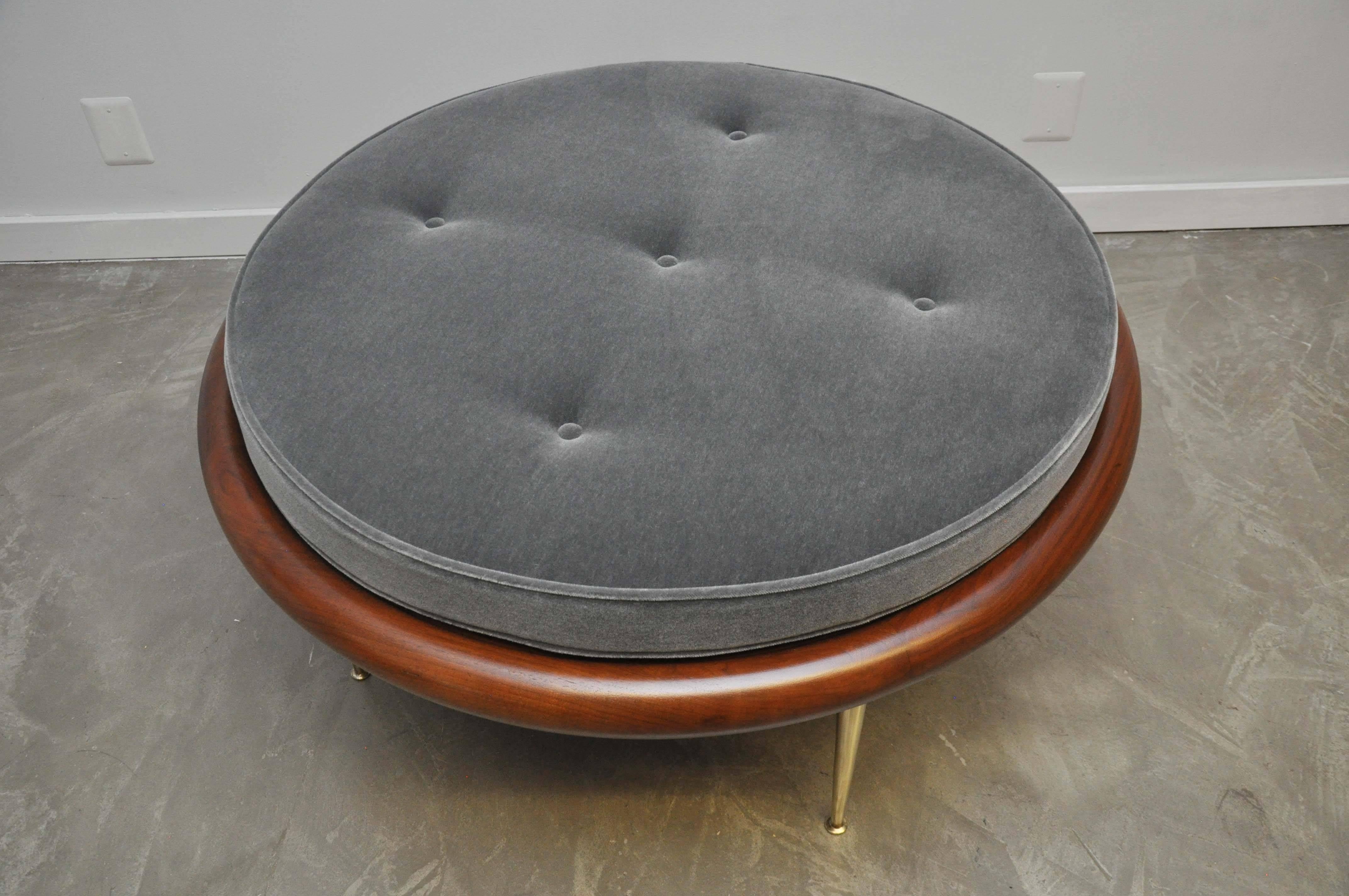 Rare brass leg pouf by T.H. Robsjohn-Gibbings. Versatile piece doubles as coffee table. Fully restored. Refinished Walnut base with high polish brass legs. New mohair cushion. Early model 1745. 20