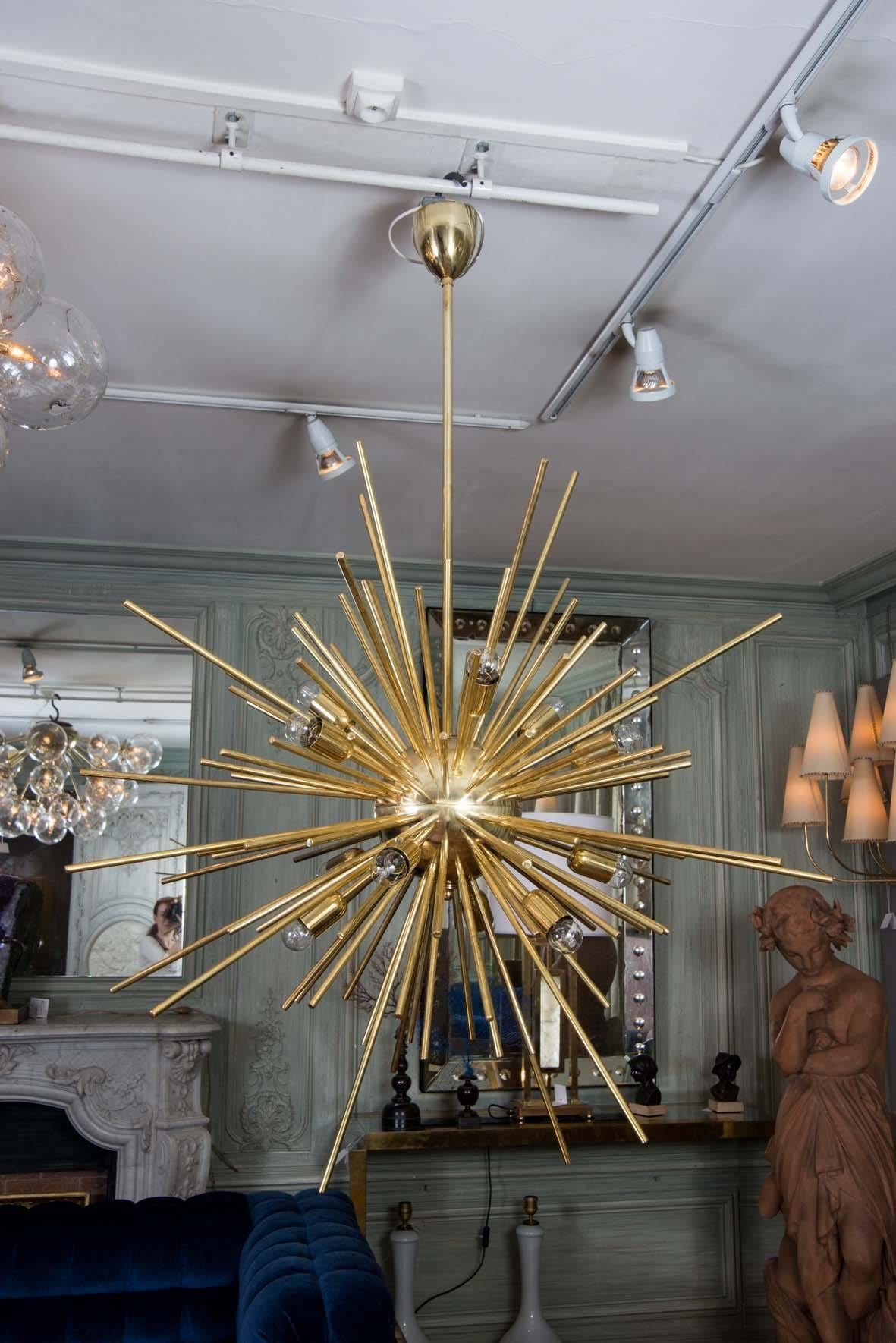 Chandelier in brass, Sputnik shape with three different dimensions of peaks.
One pair available.