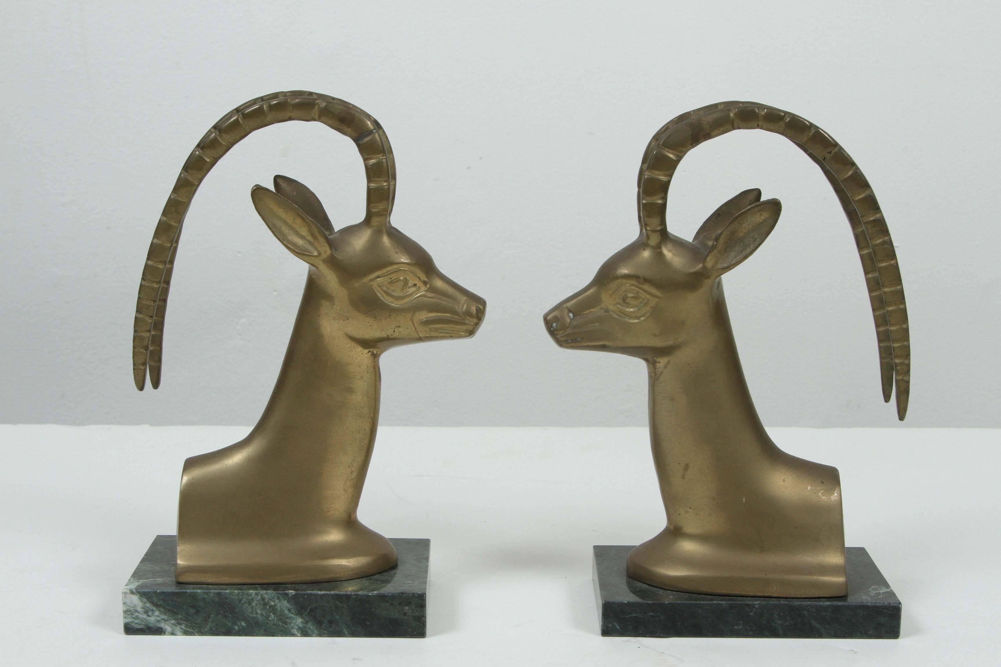 Set of vintage brass antelope on marble stand bookends.
size for each is 8
