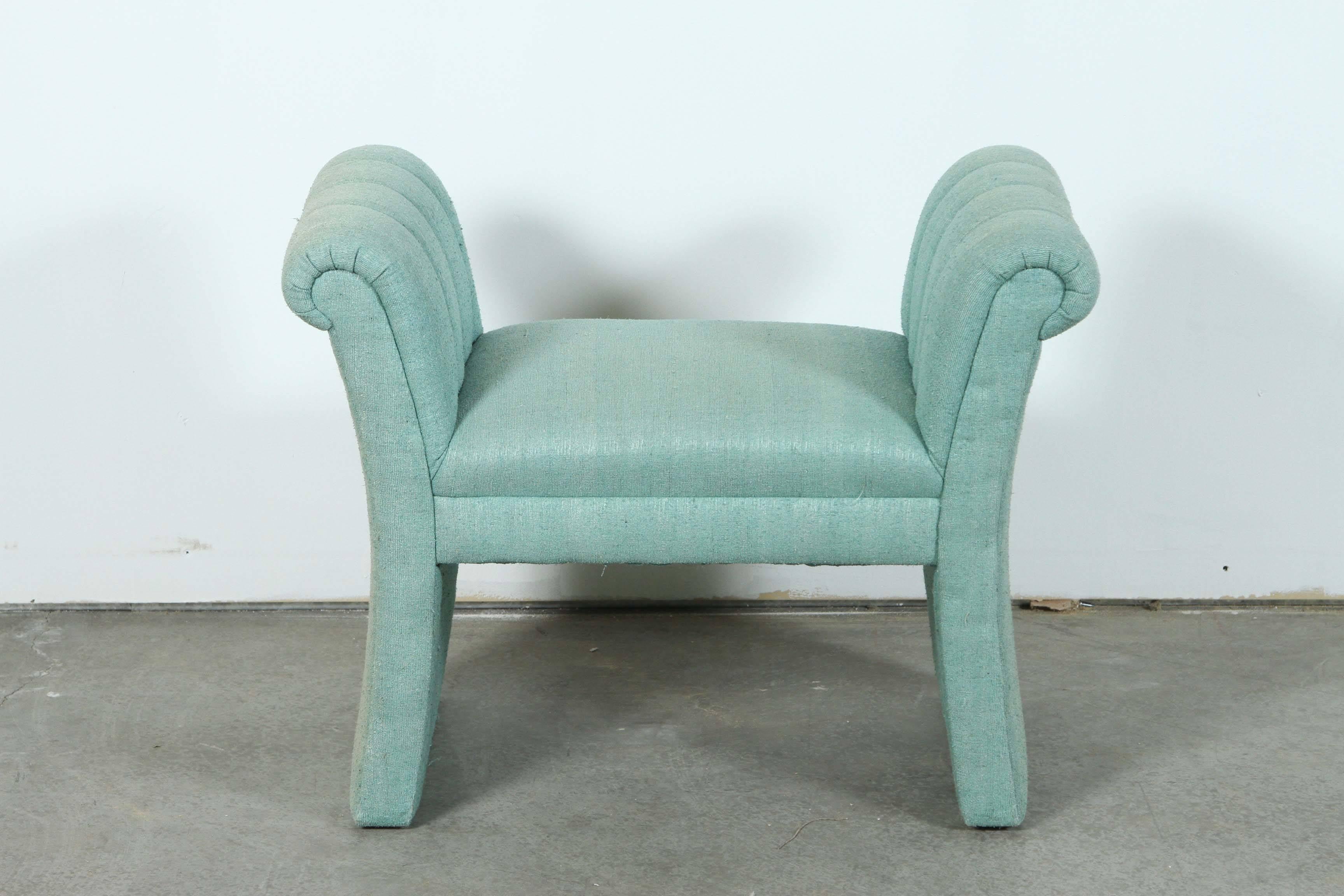 Hollywood Regency bench with channel arms by Steve Chase. 
The bench retains its original teal fabric upholstery.
There is slight fading which is consistent throughout.