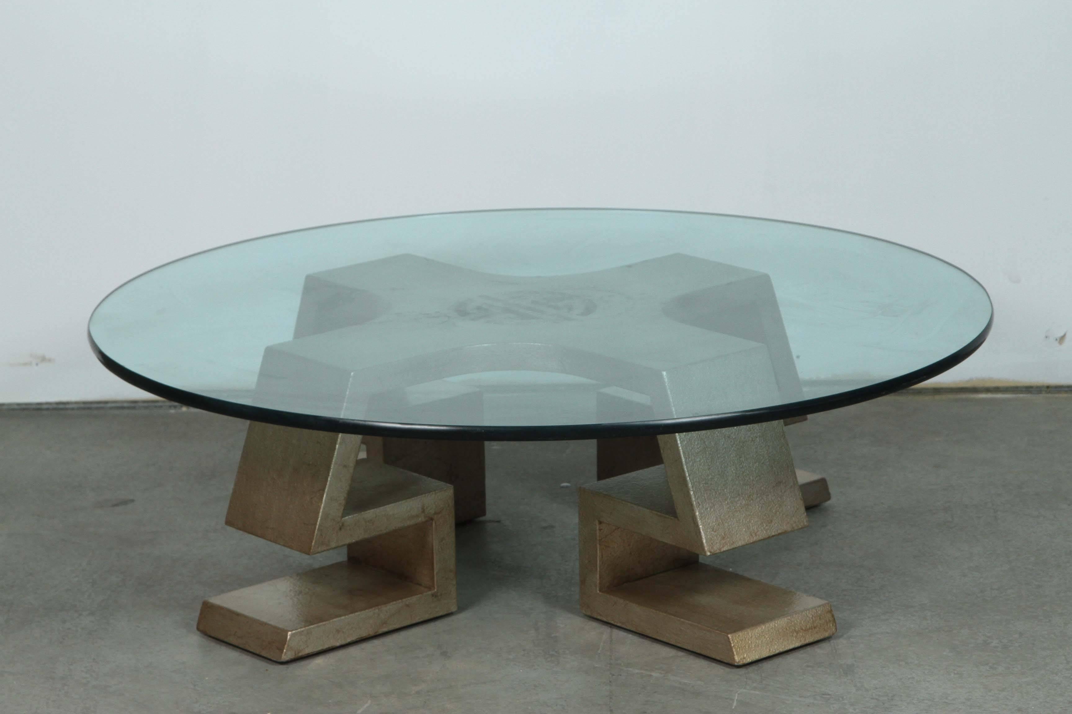 Exquisite and rare coffee table by James Mont.
The table base has a central oriental medallion and has been newly refinished in a glazed silver leaf finish.
The table base supports a 3/4