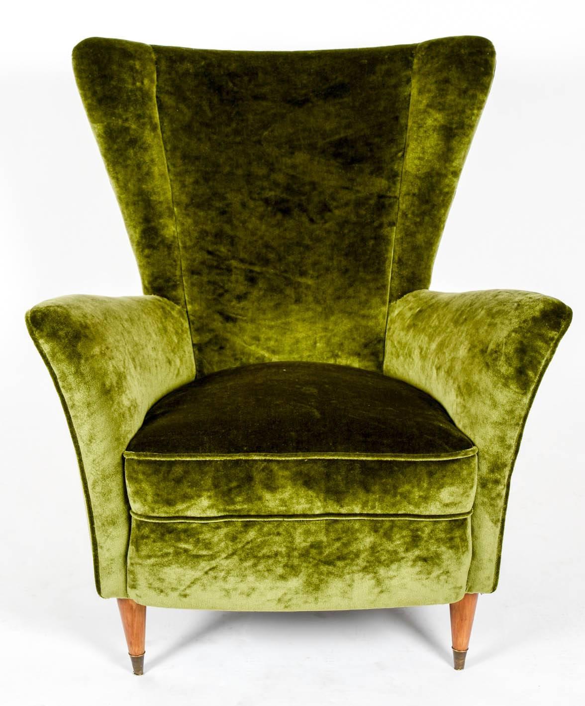 Pair of vintage armchairs, newly upholstered with a green Rubelli velvet, four wood legs, the two front legs with brass casters.