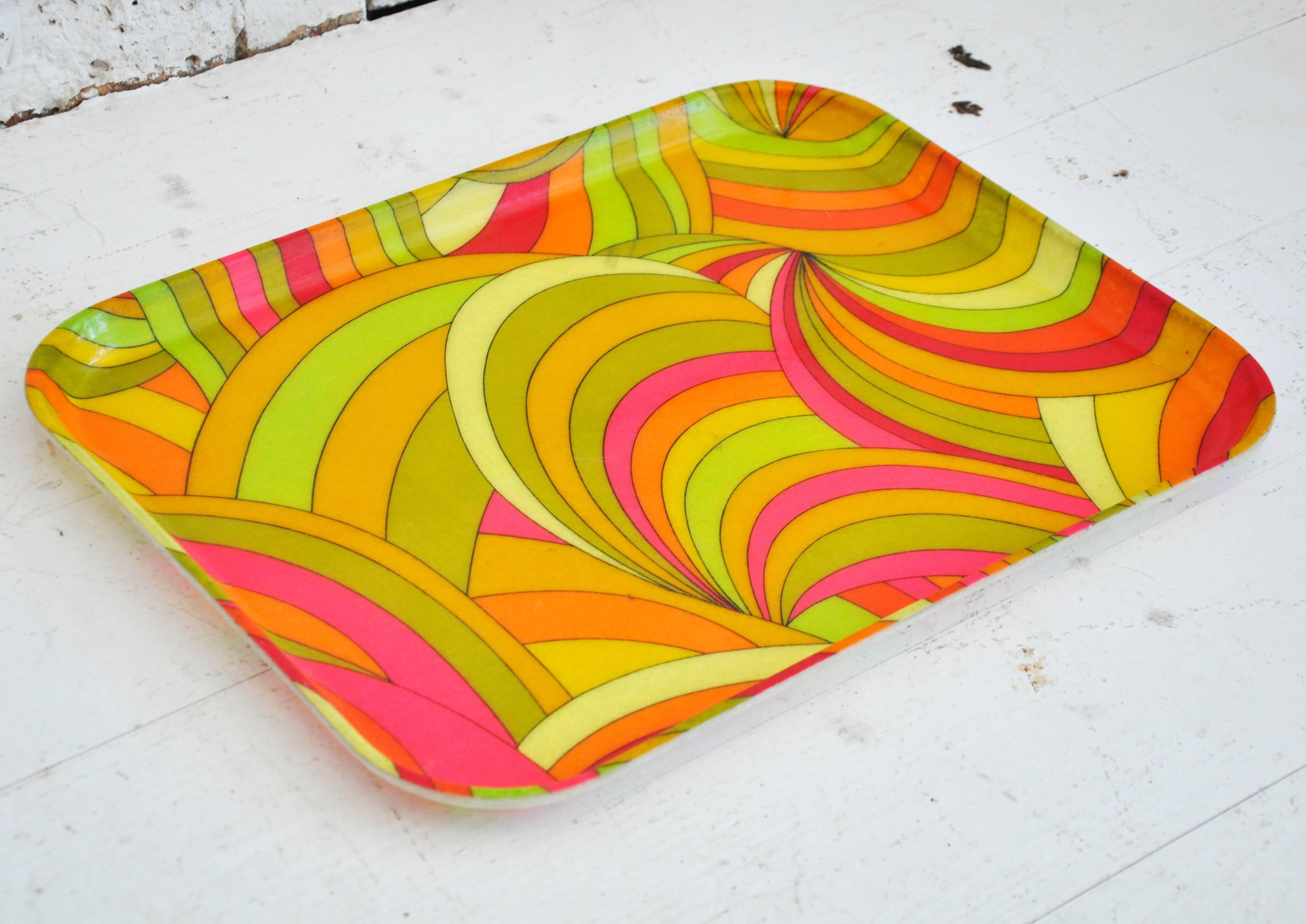 Colorful to the hilt! This vintage plastic tray makes a statement on a tabletop or as a backdrop within book shelving. Mad, mod and wonderful.