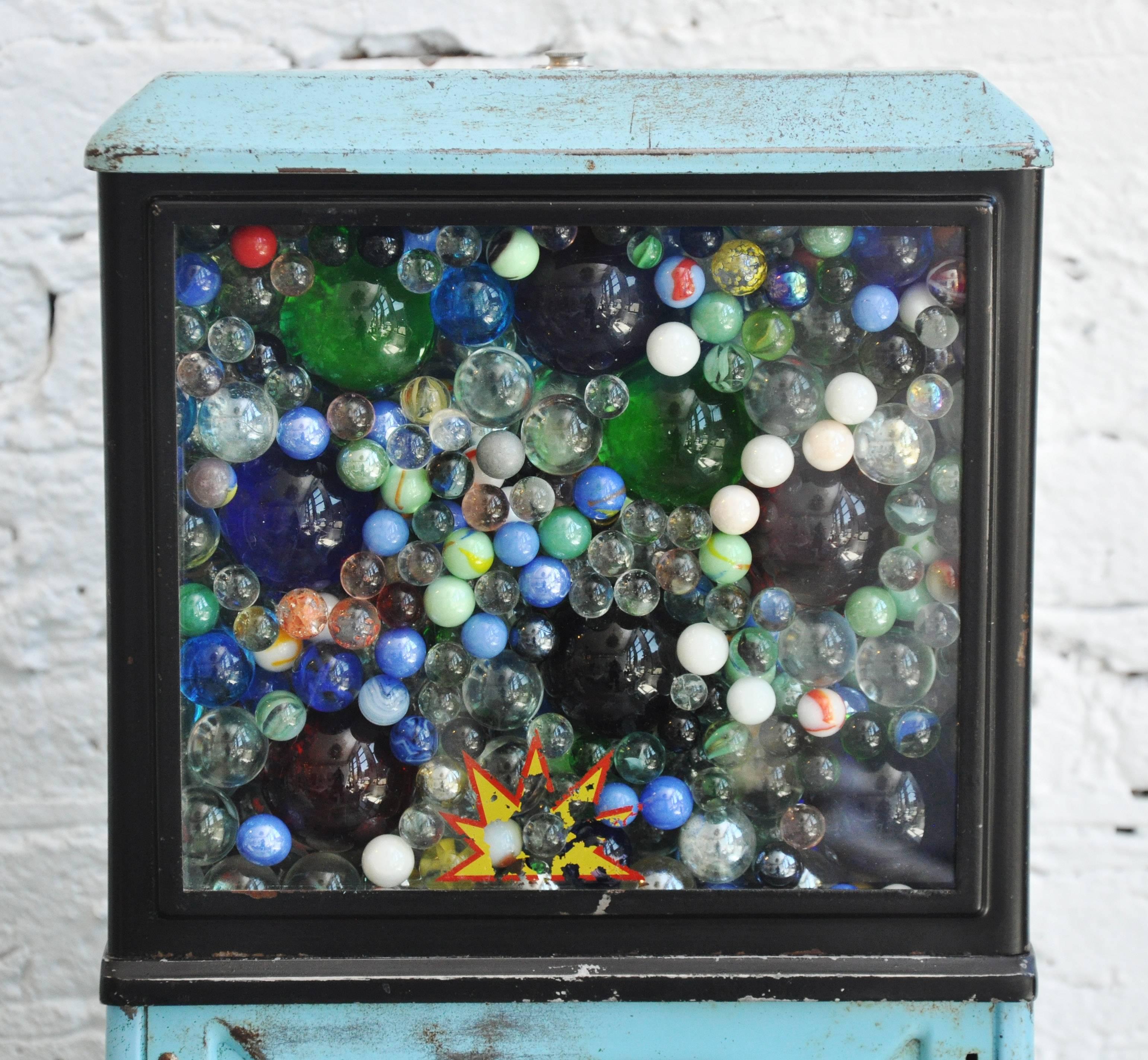 This particularly whimsical piece is made up from a vintage gumboil machine which has been filled with vintage glass marbles.
This piece has a touch lighting element with three different intensities of glow.
Unbelievable colors and when