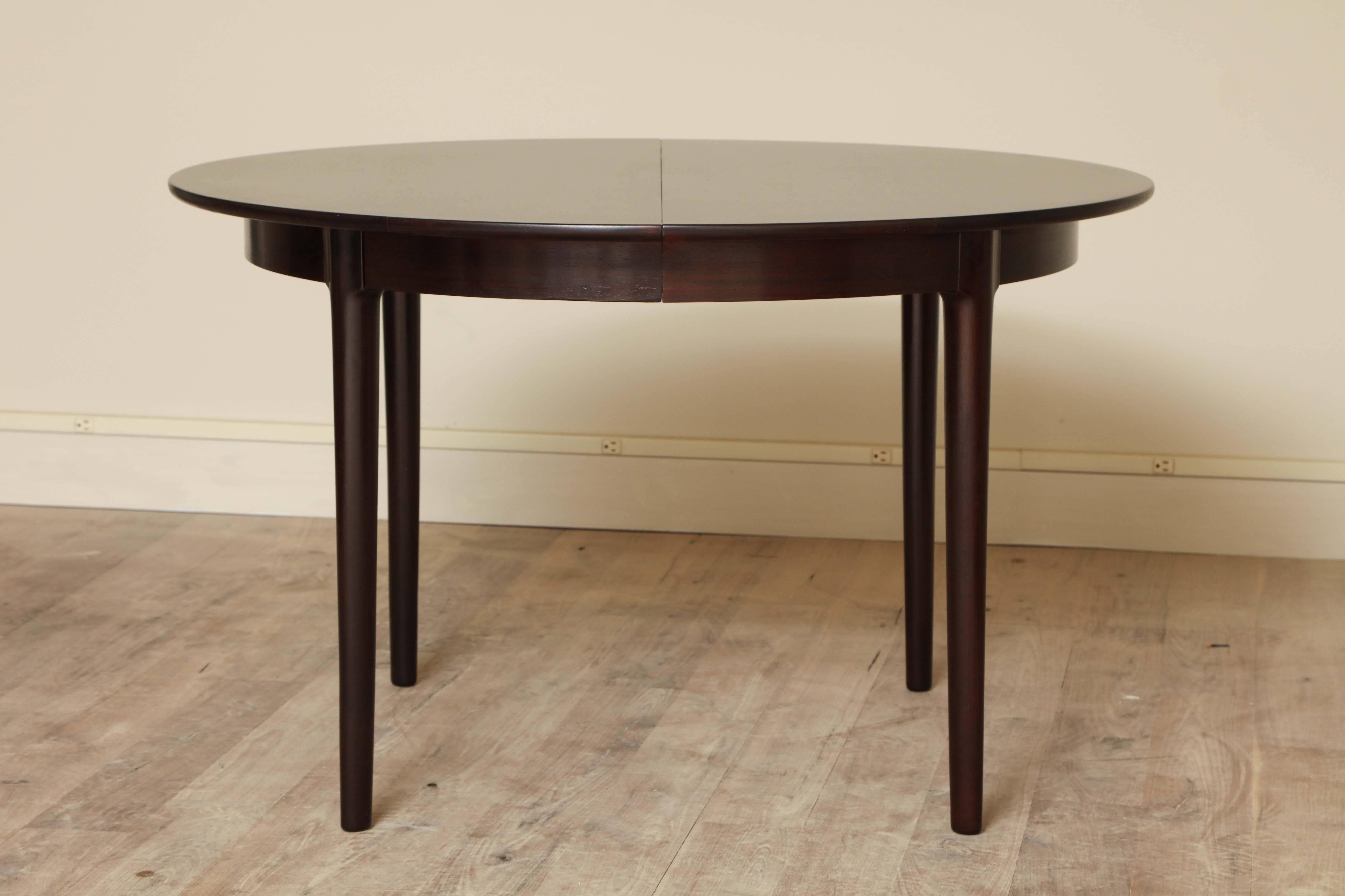Rosewood dining table in the manner of Neils Otto Møller, circa 1960. Two, 17-3/4