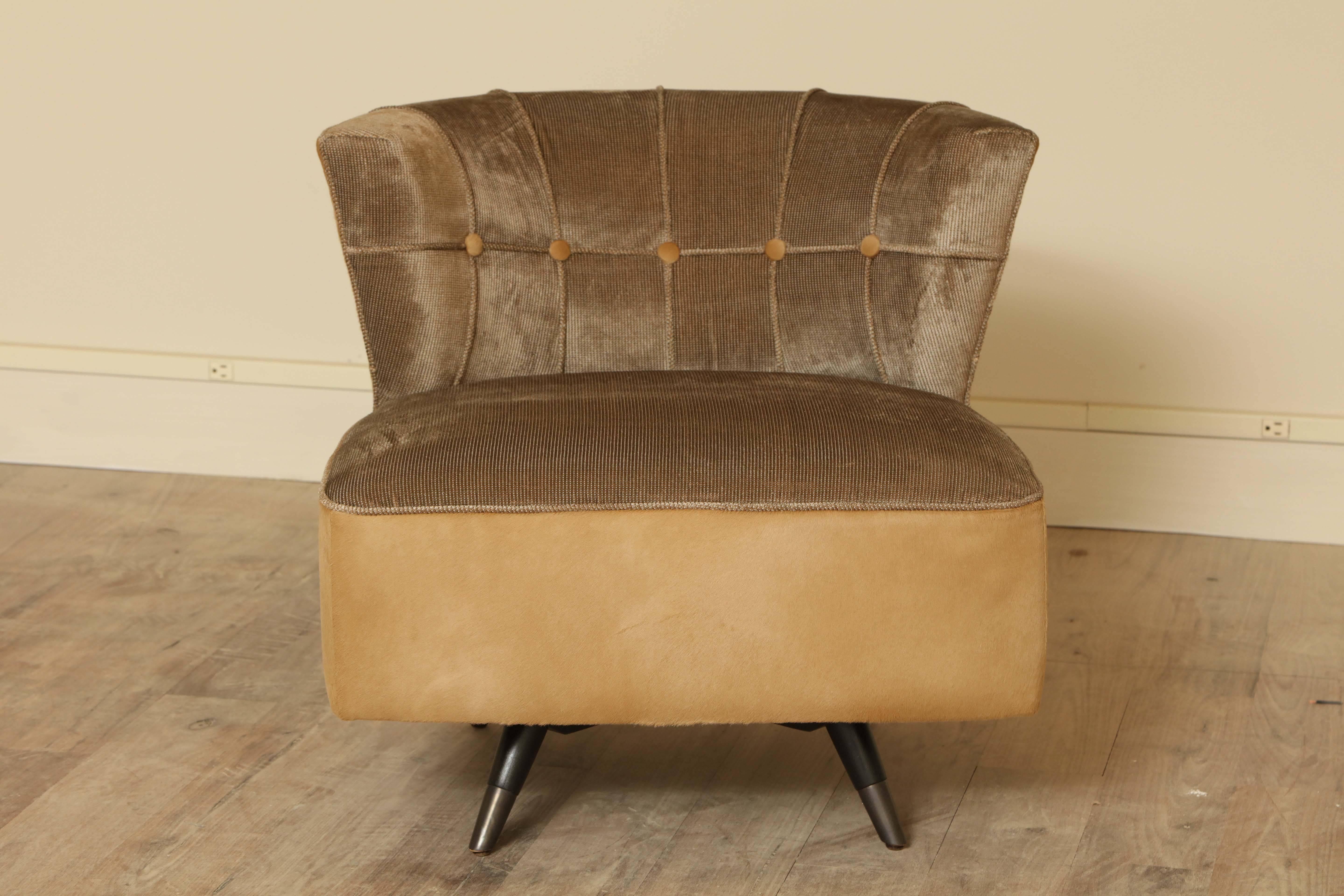 Pair of button tufted barrel back swivel chairs by Kroehler, circa 1960 upholstered in taupe Parris velvet by Thomas O'Brien for Lee Jofa with calf hair on hide bases and outside backs.