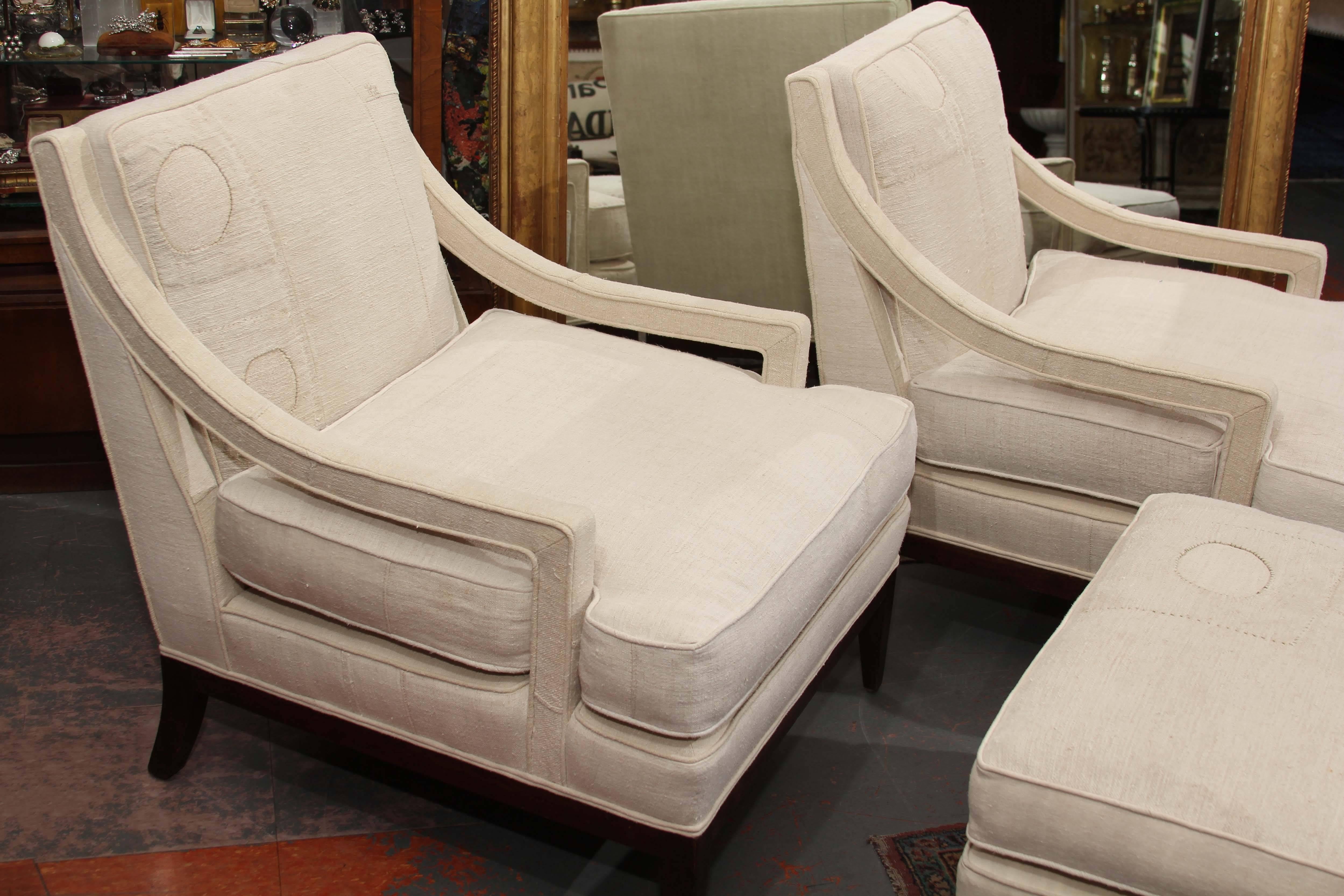 Great looking and sitting pair of Erwin-Lambeth chairs and ottomans redone in heavy antique French homespun with original patches included in the upholstery.
Reversible cushions, very handsome chairs.