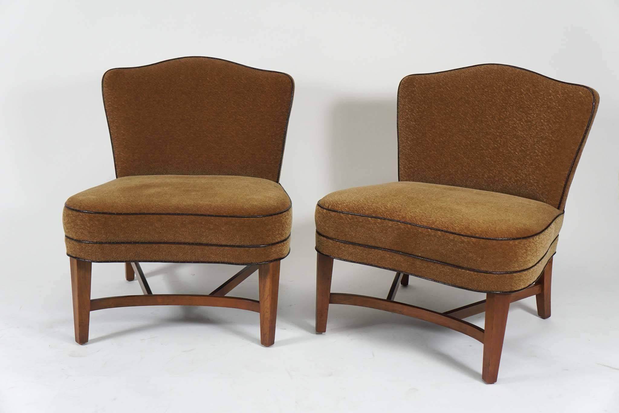 The perfect slipper chairs. Beautifully scaled with the most gorgeous curves. Recently reupholstered in a Donghia butterscotch mohair with faux croco piping.