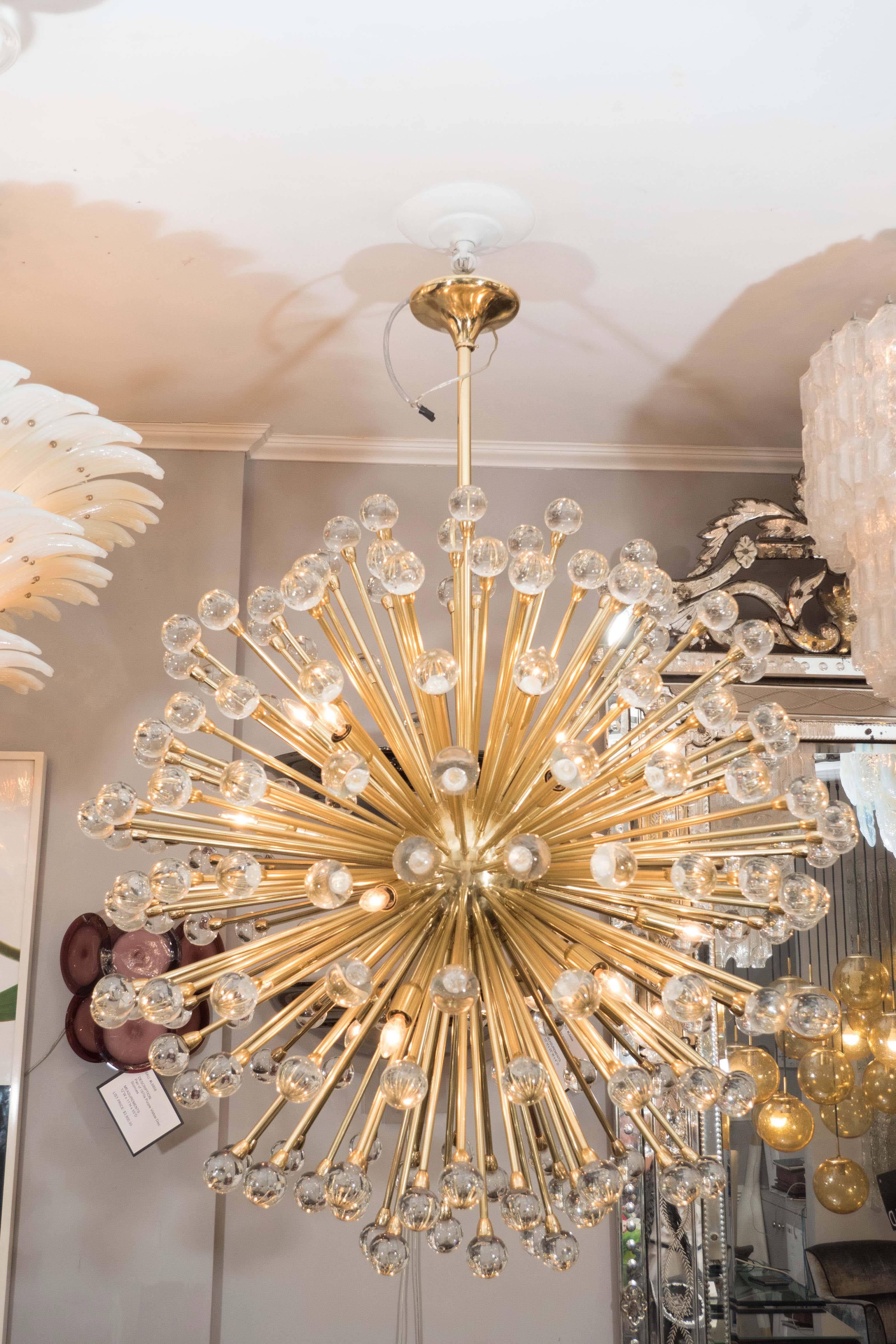 Stunning huge Murano glass ball sputnik chandelier in polished brass finish. This listing is for a floor model chandelier that is in excellent condition. 