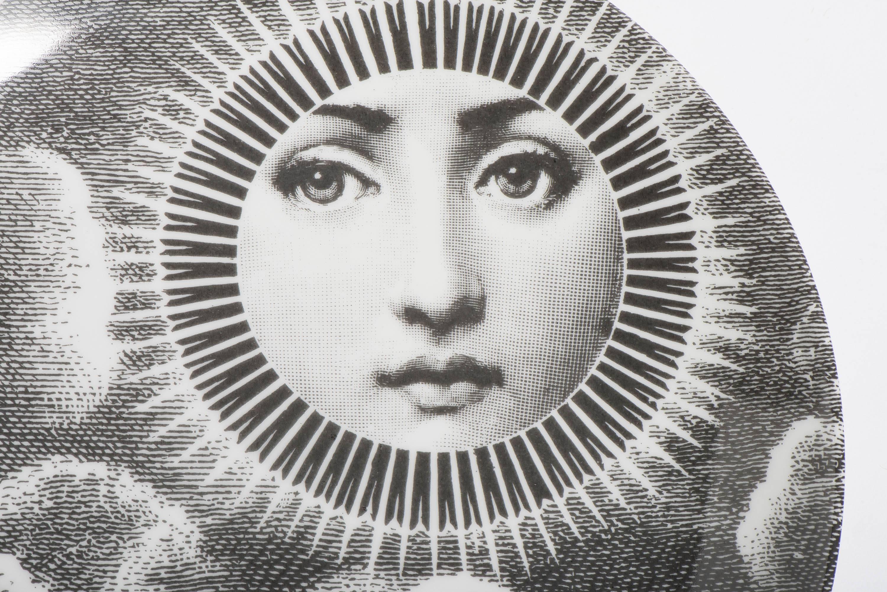 A porcelain Plate by Atelier Fornasetti.
“Themes and Variations”
Lithographically printed.
Marks to back,
Italy, circa 1990.
Measures: 26 cm diameter.
 