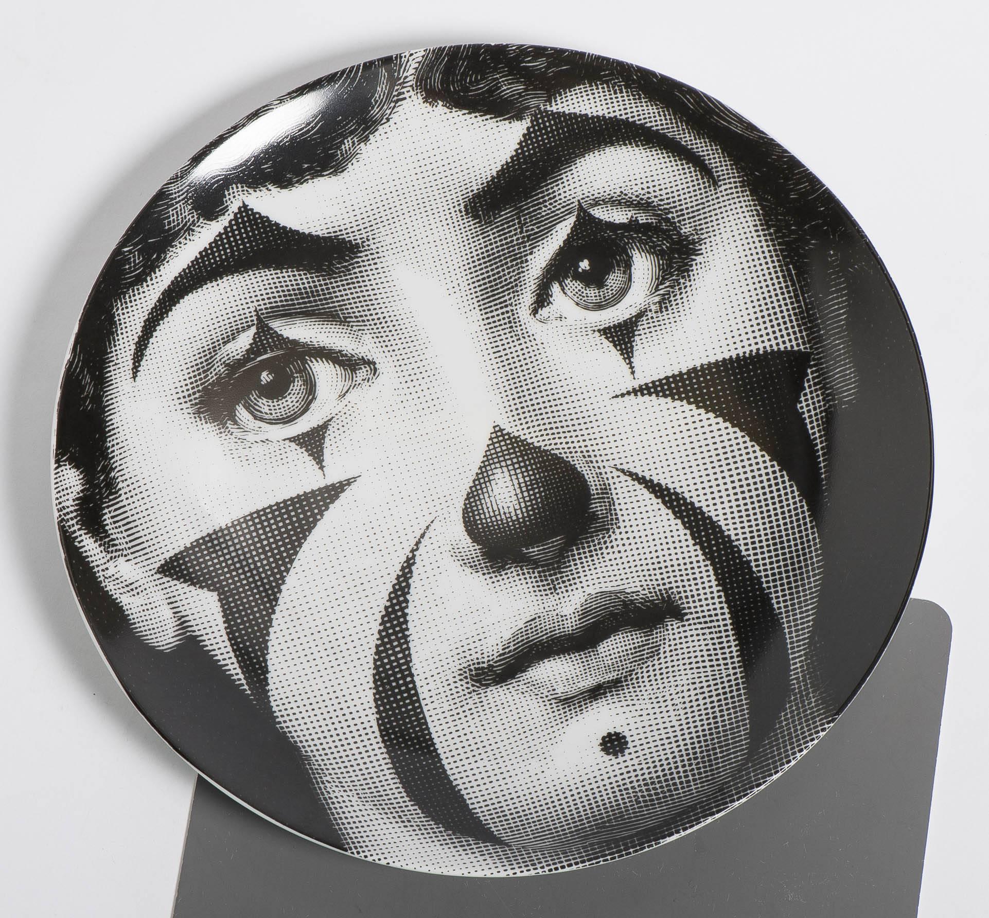 A porcelain plate by Atelier Fornasetti.
“Themes and Variations.”
Lithographically printed.
Marks to back.
Italy, circa 1990.
26 cm diameter.
     