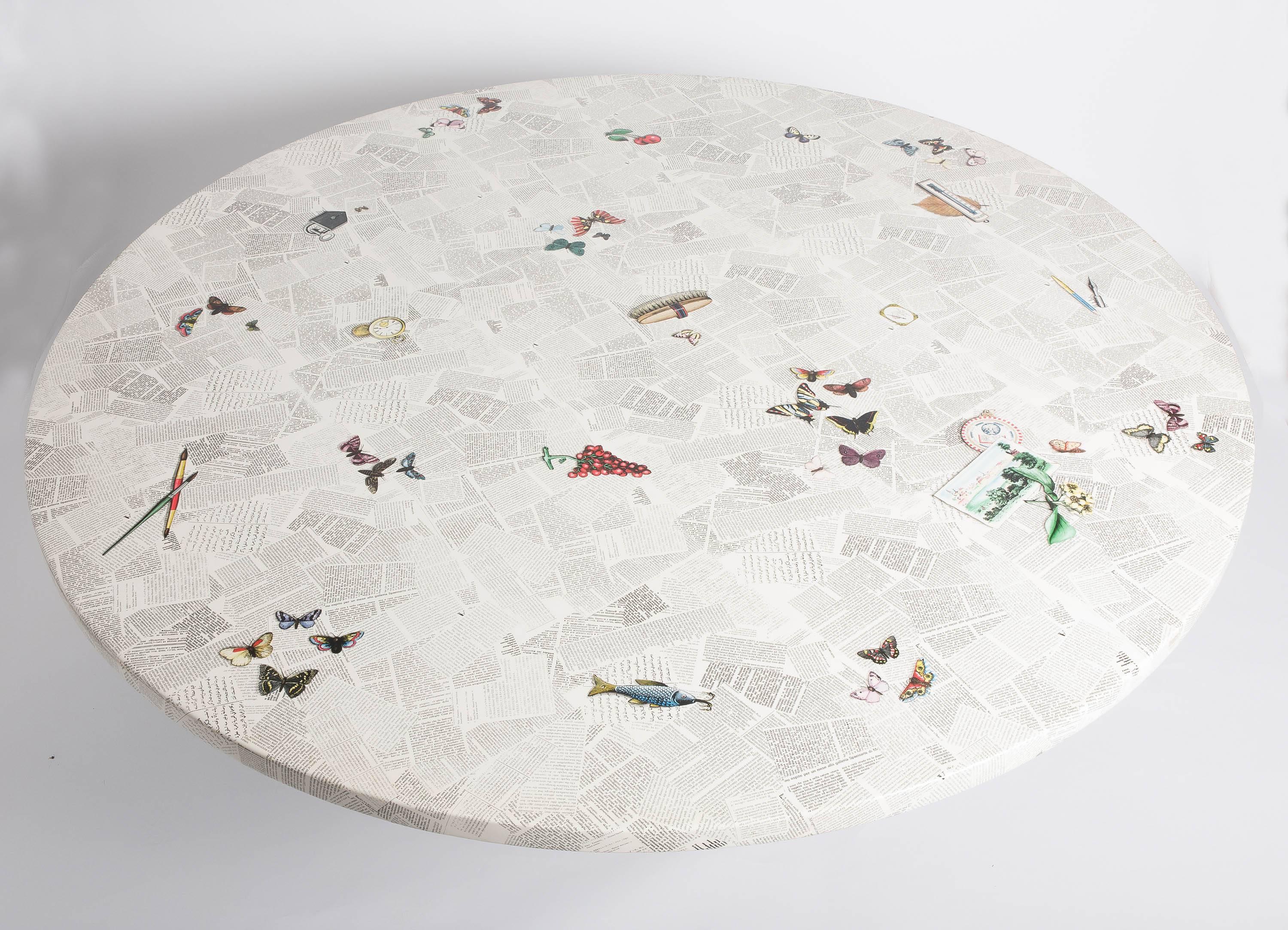 A very rare large centre table by Barnaba Fornasetti.
“Ultime Notizie”
Lithographically printed and hand colored.
Seats 10-12 people.
Wood, lacquer and metal base,
Italy, circa 1995.
Measures: 170 cm diameter x 73 cm high.
 